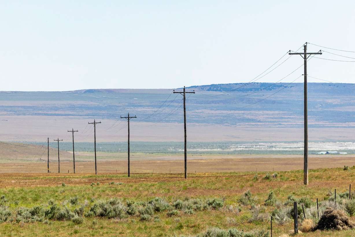 Power lines stand on land proposed to be used for the Stratos Project data center in the Hansel Valley area of Box Elder County on May 12. Researcher Shon Hiatt says data centers could have an impact on power prices.