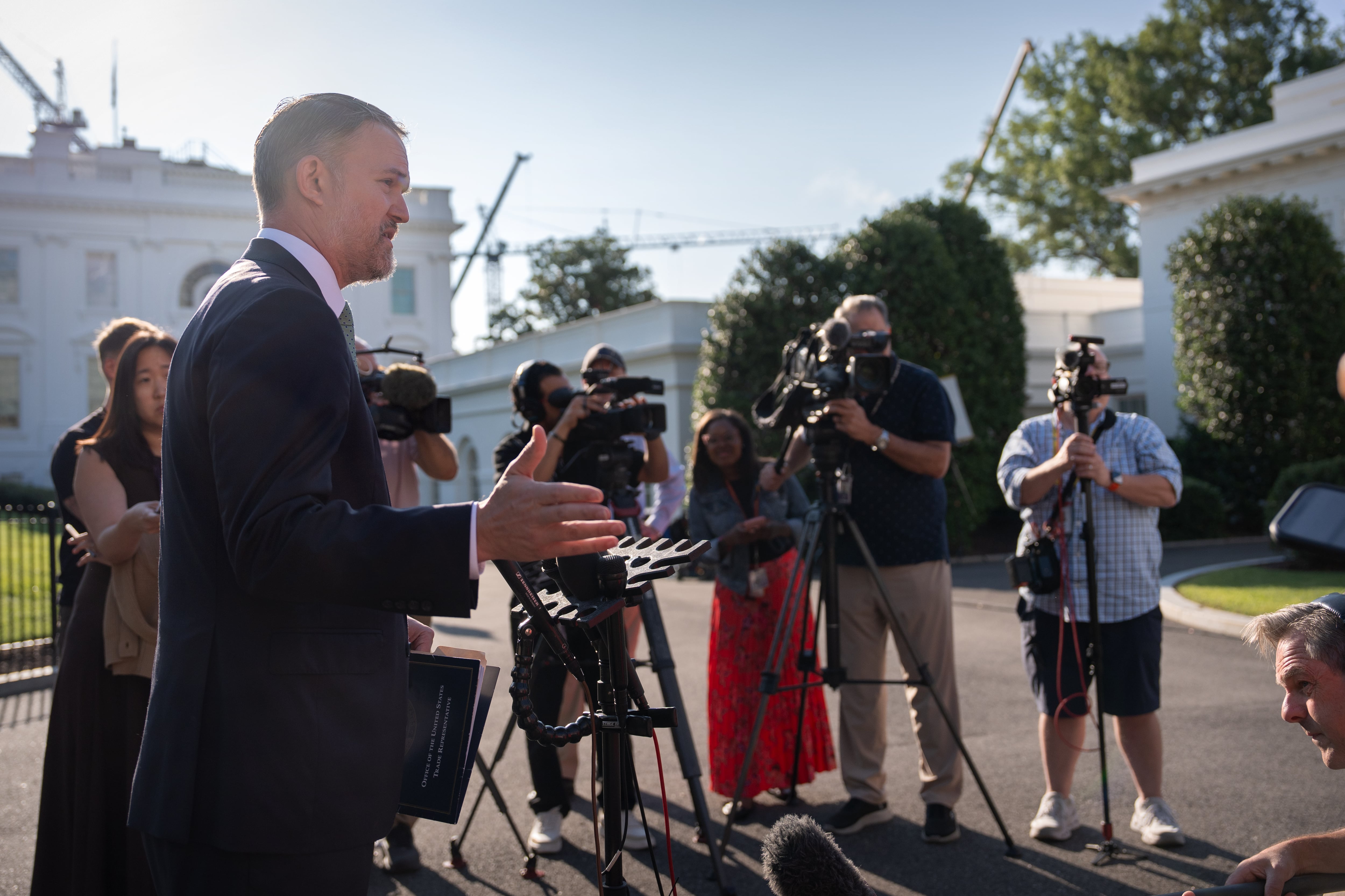 Trade Representative Jamieson Greer speaks to reporters outside the White House, Aug. 24, in Washington. Greer met with House Republicans in a closed-door meeting on Wednesday.
