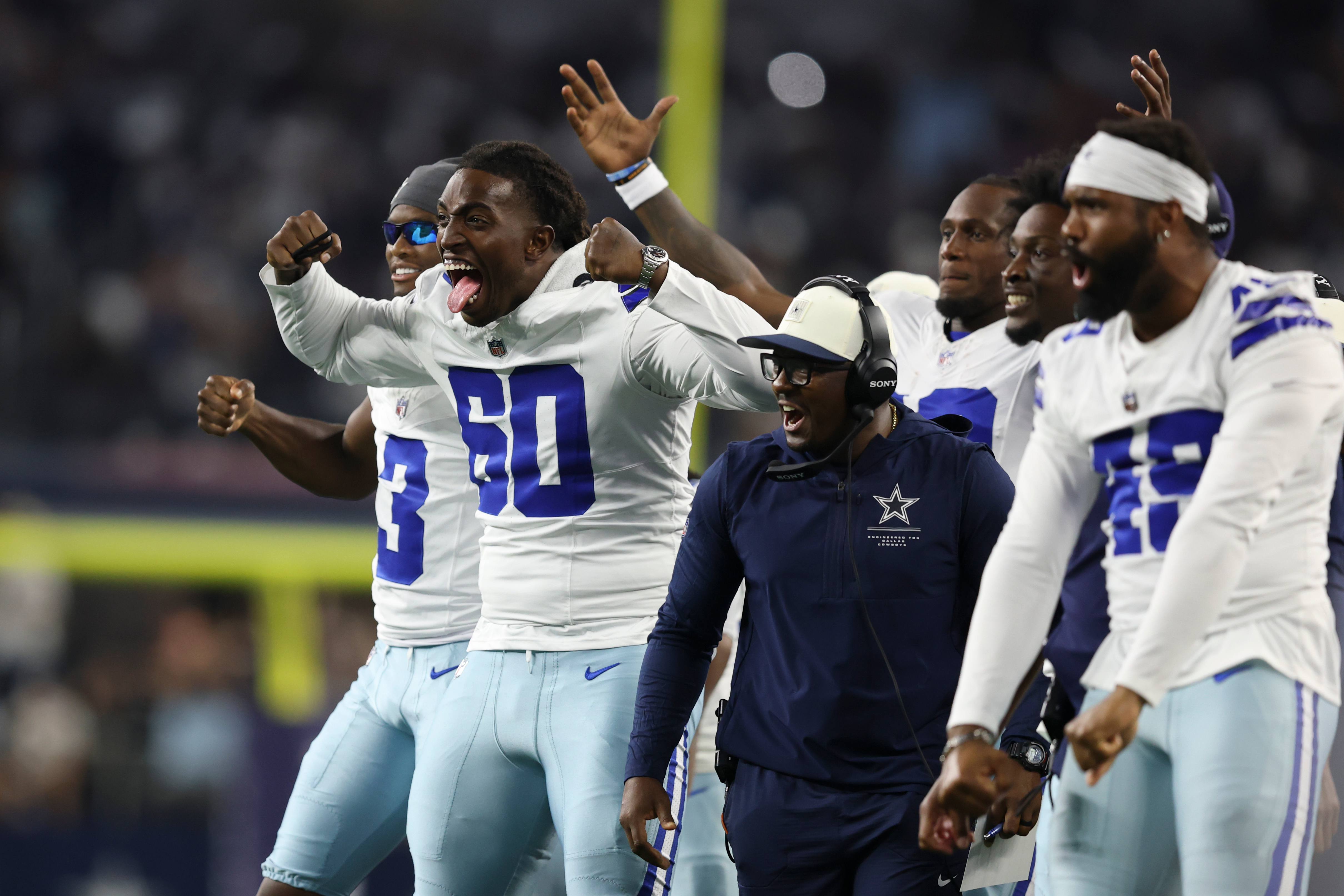 Dallas Cowboys offensive tackle Tyler Guyton (60) celebrates on the sideline after a two-point conversion against the New Orleans Saints during the second half of a preseason NFL football game, in Arlington, Texas, Friday, Aug. 28, 2026. 