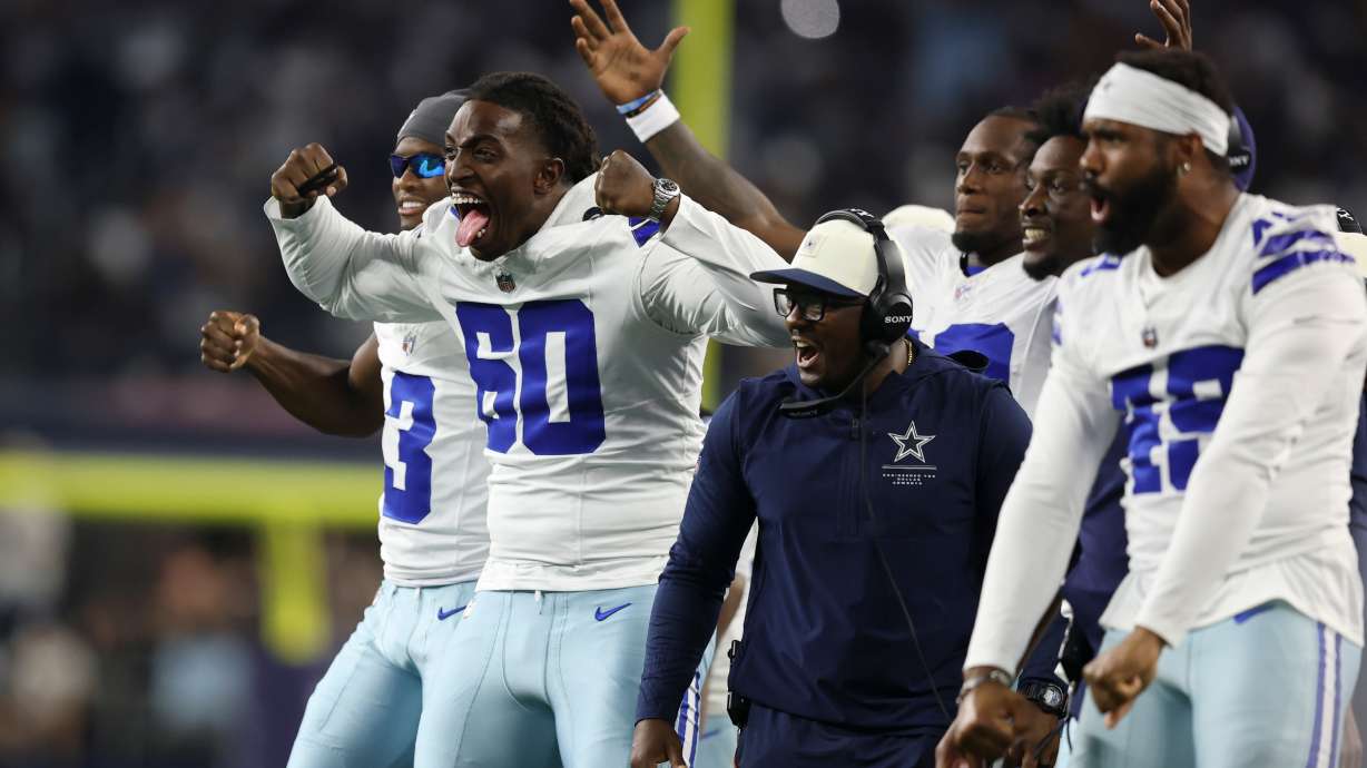 Dallas Cowboys offensive tackle Tyler Guyton (60) celebrates on the sideline after a two-point conversion against the New Orleans Saints during the second half of a preseason NFL football game, in Arlington, Texas, Friday, Aug. 28, 2026.