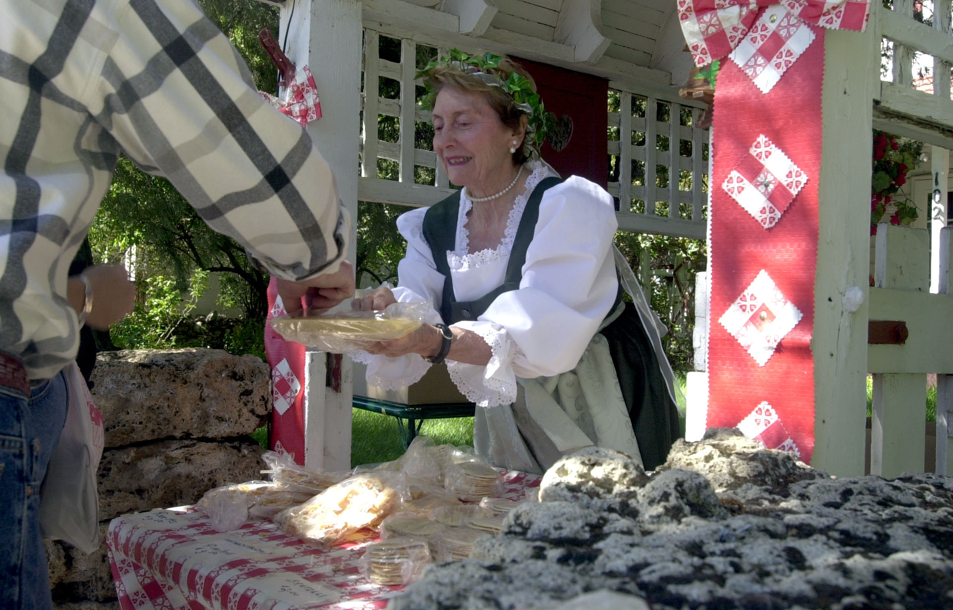 June Tatton hands out samples of Swiss pastries she is selling during Swiss Days Festivities in Midway, Sept. 2, 2000.