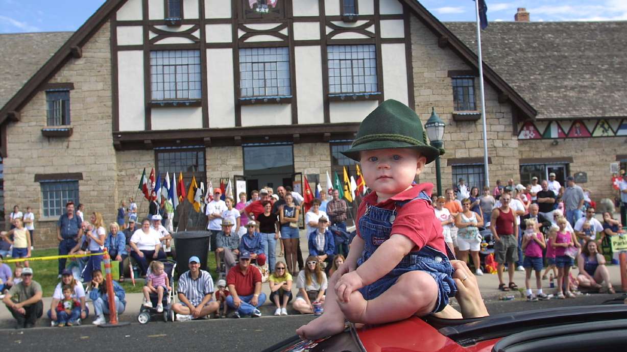 Matthew Larsen sits outside of his sky roof as he rides in the Swiss Days parade float in Midway on Sept. 1, 2001.