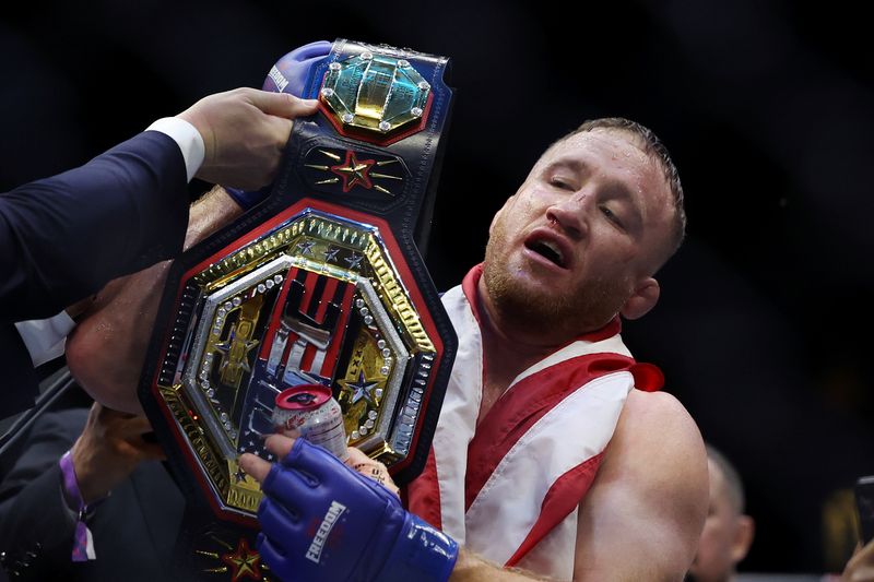 Jun 14, 2026; Washington, D.C., USA; Justin Gaethje (blue gloves) celebrates after winning the UFC Freedom 250 fight against Ilia Topuria (not pictured) at the White House South Lawn.