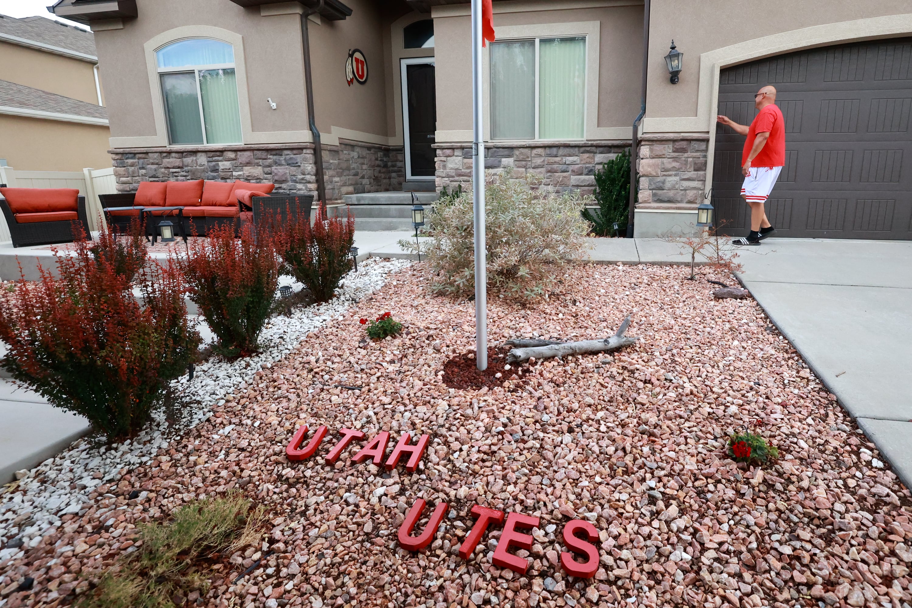 University of Utah football superfan Albert Gamboa opens his garage to show more University of Utah-themed decorations on his cars and around his house in Riverton on Aug. 24.
