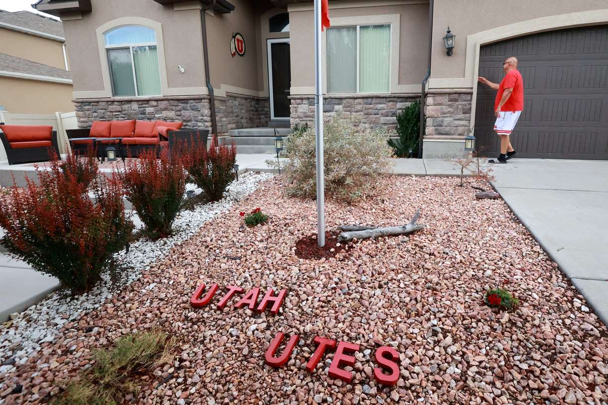 University of Utah football superfan Albert Gamboa opens his garage to show more University of Utah-themed decorations on his cars and around his house in Riverton on Aug. 24.