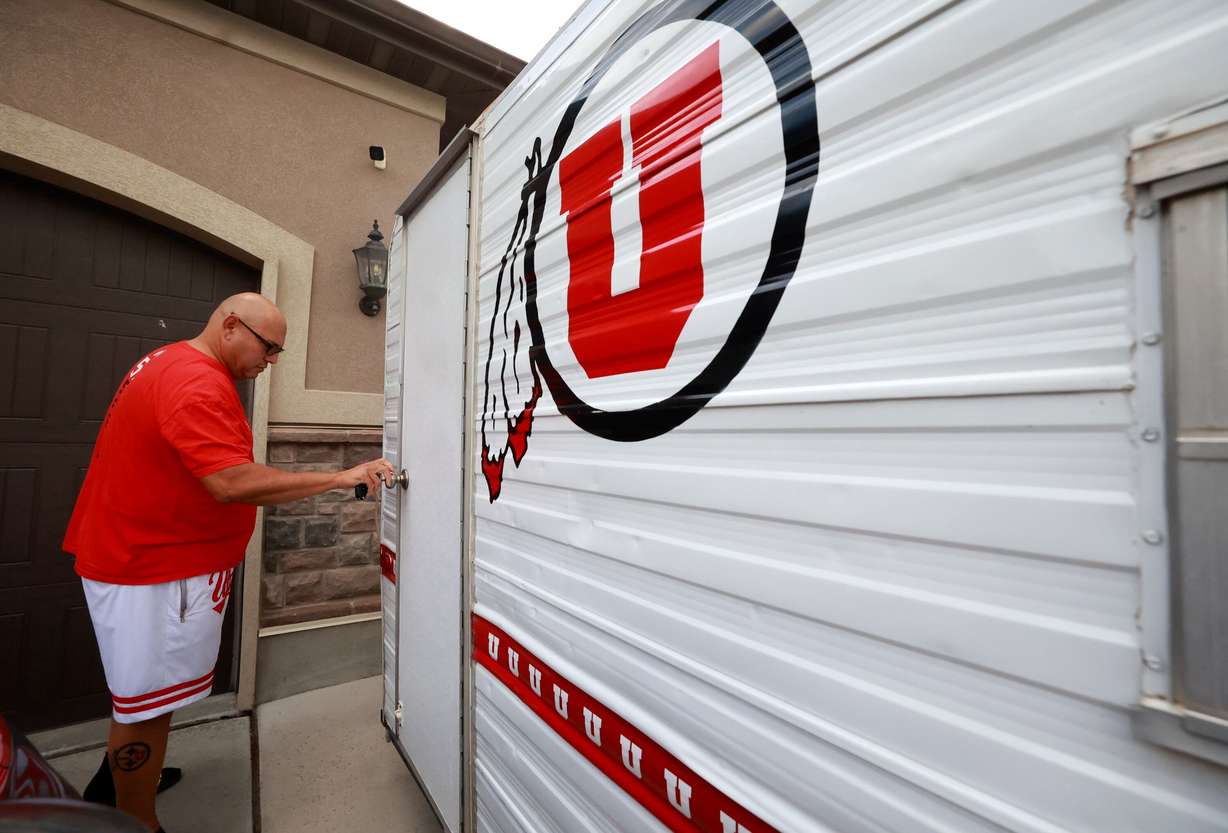 University of Utah football superfan Albert Gamboa shows his Utes-themed camping trailer that is used for tailgating in Riverton on Aug. 24.