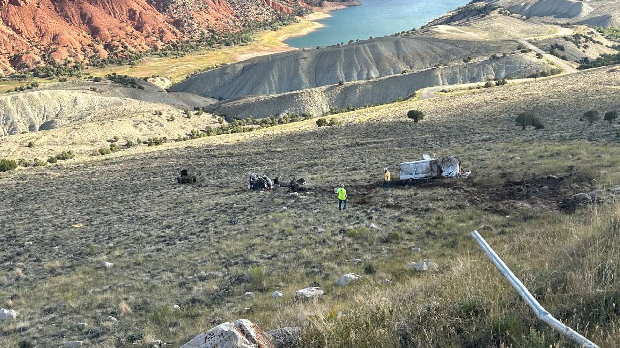 A semitruck is pictured Wednesday, after rolling and falling into an embankment near state Route 44 in Daggett County.
