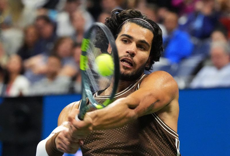 Tennis-Slow start, strong finish as Alcaraz makes US Open third round