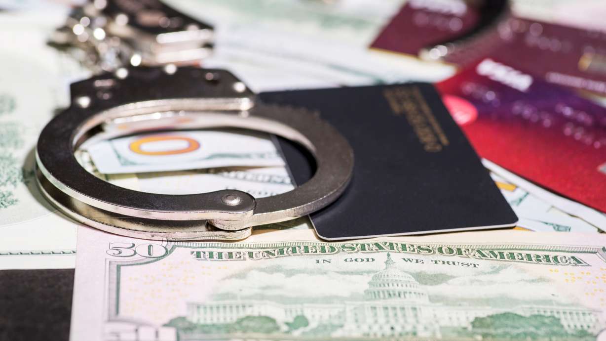 Two men have been arrested in St. George after police discovered numerous stolen financial cards and ID's following a fiery crash.