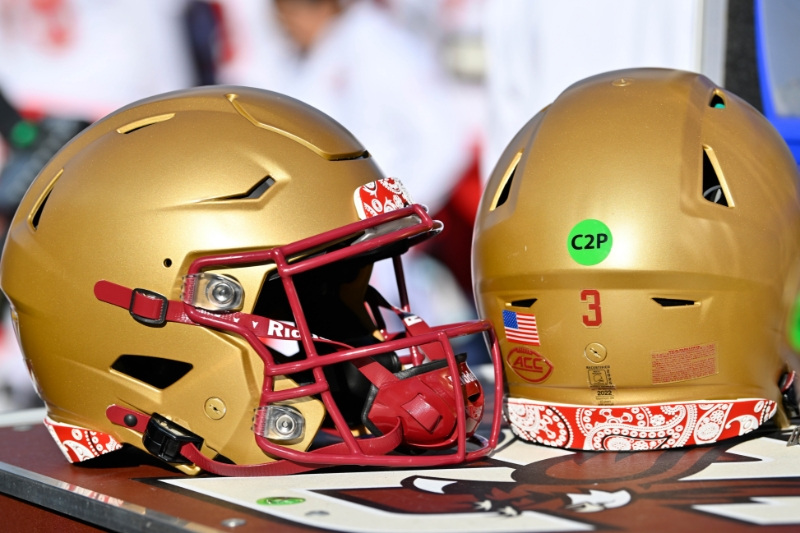 Nov 8, 2025; Chestnut Hill, Massachusetts, USA; A pair of Boston College Eagles helmets trimmed in red paisley in memory of BC alum Welles Remy Crowther are displayed on an equipment cart during the first half against the Southern Methodist University Mustangs at Alumni Stadium.