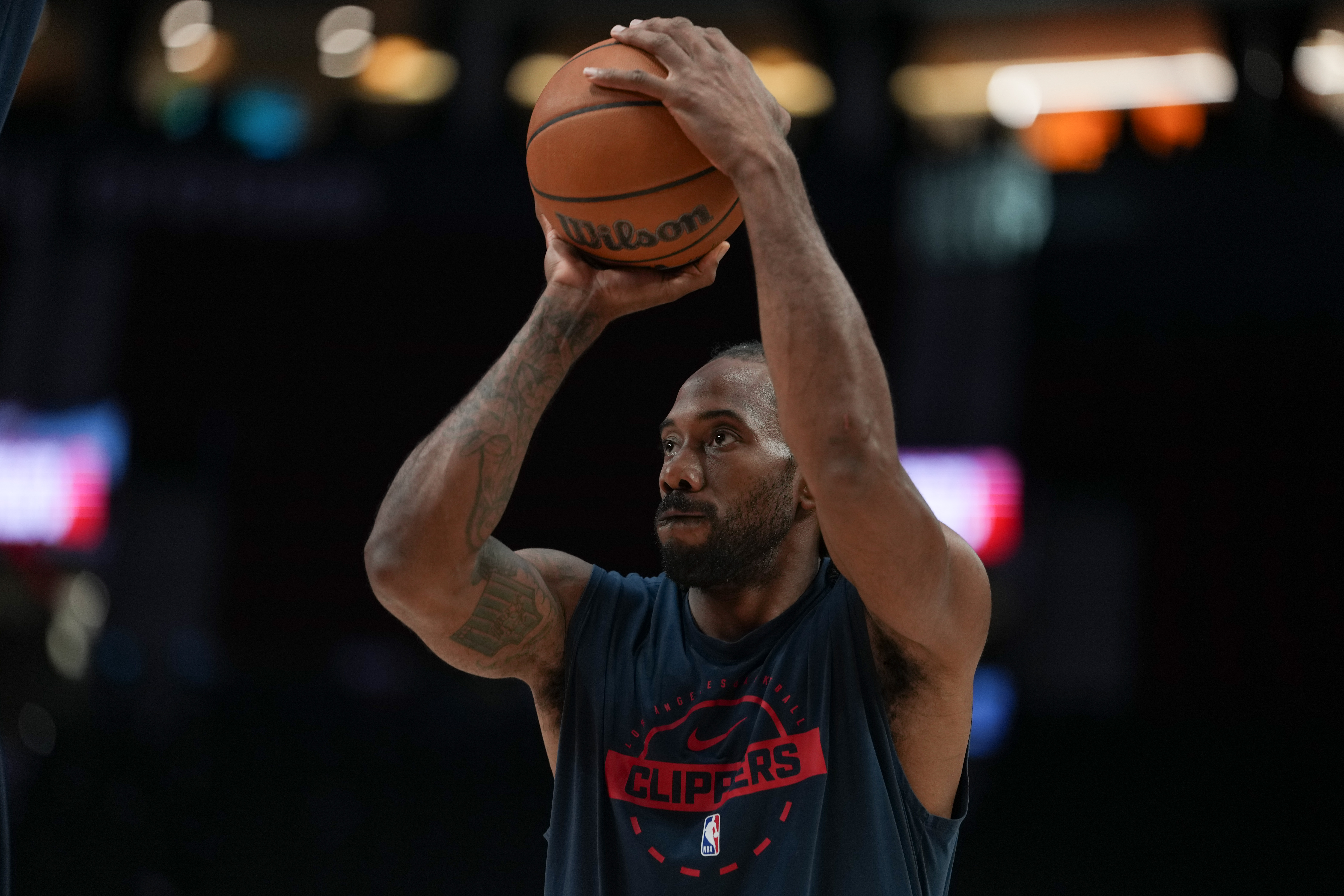 FILE - Los Angeles Clippers forward Kawhi Leonard warms up before an NBA basketball game April 10, 2026, in Portland, Ore. 