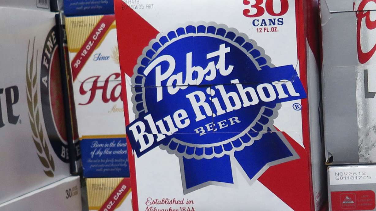 FILE - Cases of Pabst Blue Ribbon beer are stacked in a liquor store, Nov. 8, 2018, in Milwaukee.
