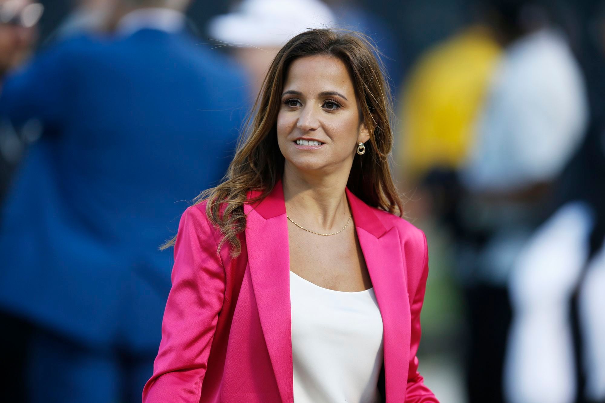 ESPN reporter Dianna Russini on the sidelines before the start of an NFL football game between the Oakland Raiders and the Denver Broncos in September 2019, in Oakland, California.