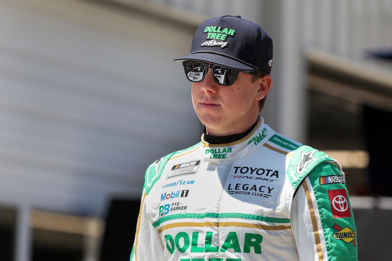 May 16, 2026; Dover, Delaware, USA; NASCAR Cup Series driver John Hunter Nemechek walks in the garage during qualifying for the NASCAR All-Star Race at Dover Motor Speedway.