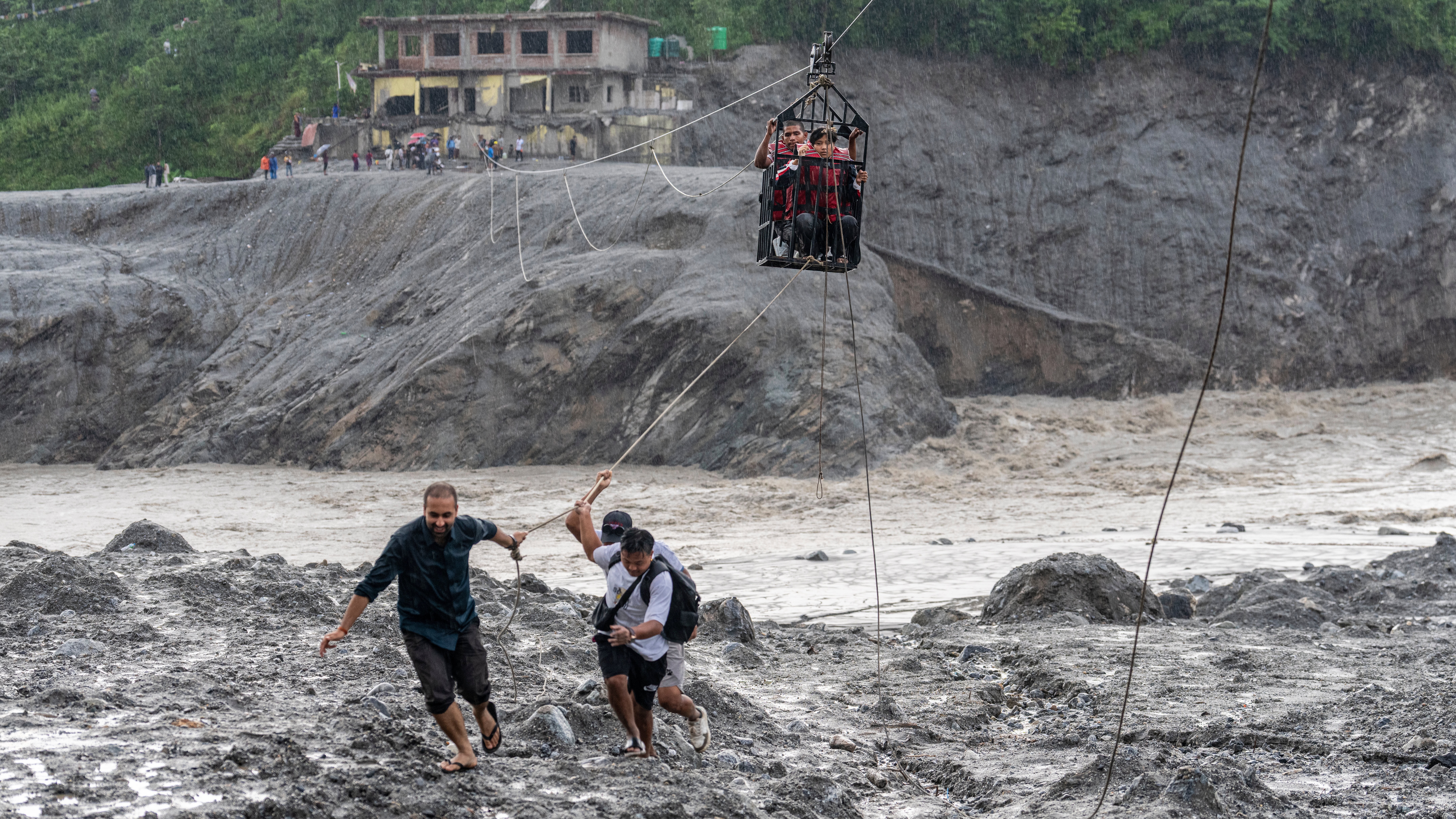 A newly installed zipline to help people cross the Trishuli River in the aftermath of flash floods at Bidur in Nepal on Wednesday. A Utah restaurateur is holding a fundraiser to aid flood-ravaged Nepal.