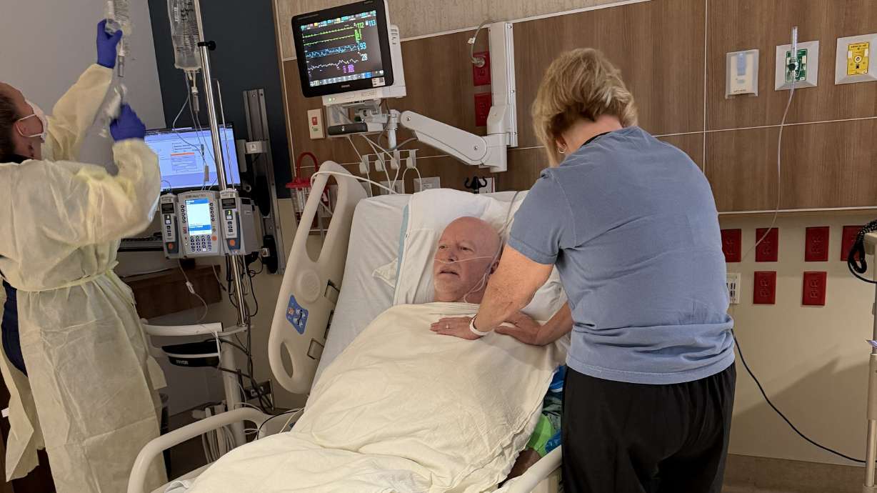 Joyce Christensen visits her husband, David Christensen, who was diagnosed with a form of West Nile virus in Davis County.