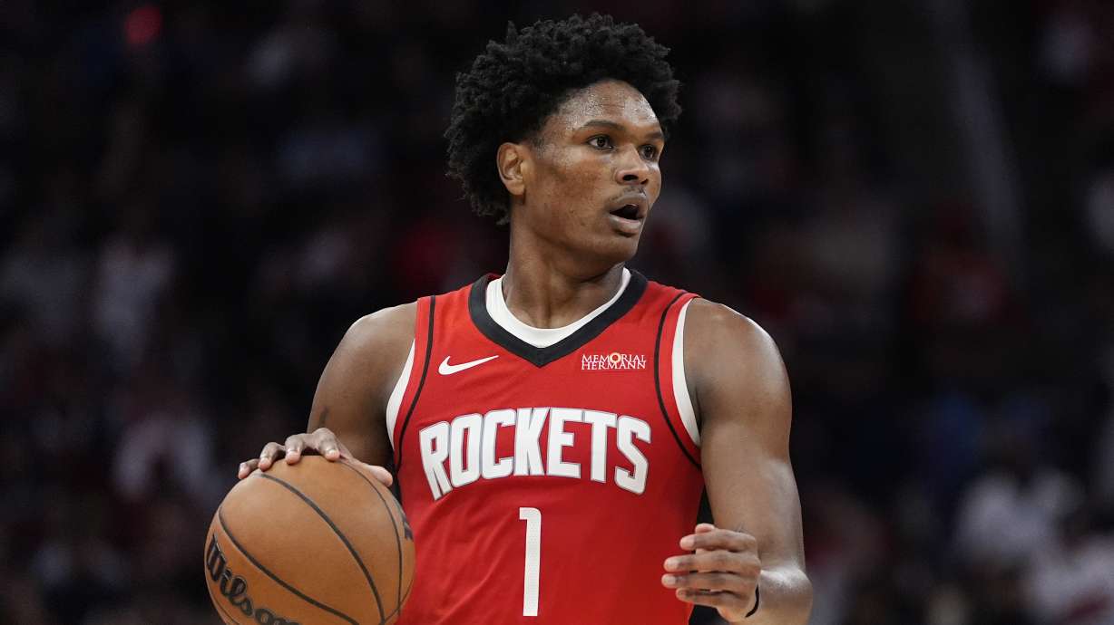 FILE - Houston Rockets guard Amen Thompson controls the ball during the second half of an NBA basketball game against the San Antonio Spurs in Houston, Jan. 20, 2026.