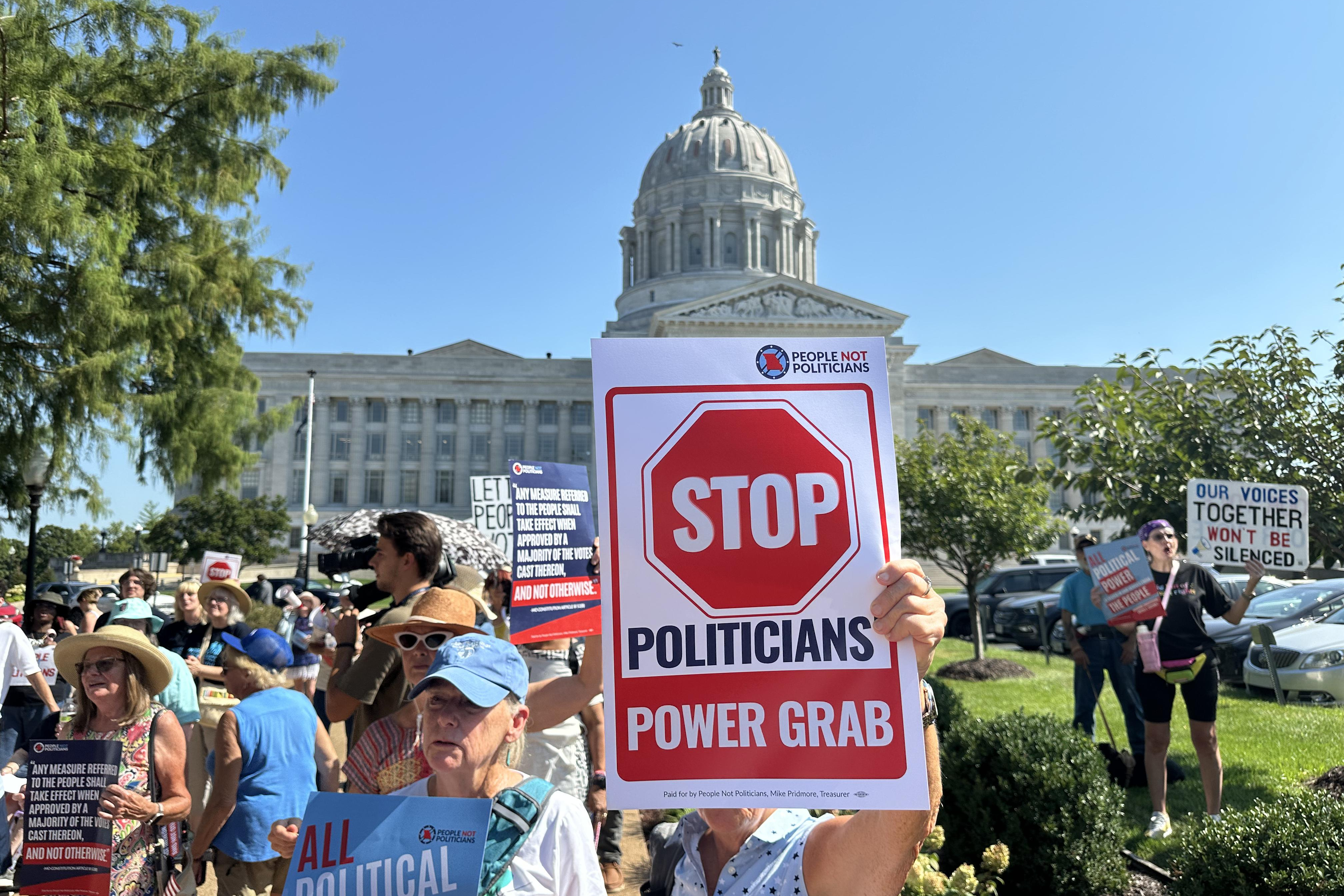 People opposed to a congressional redistricting plan rally outside the Missouri Capitol in Jefferson City, Mo., Wednesday. The plan was unanimously blocked by the state Supreme Court on Thursday.