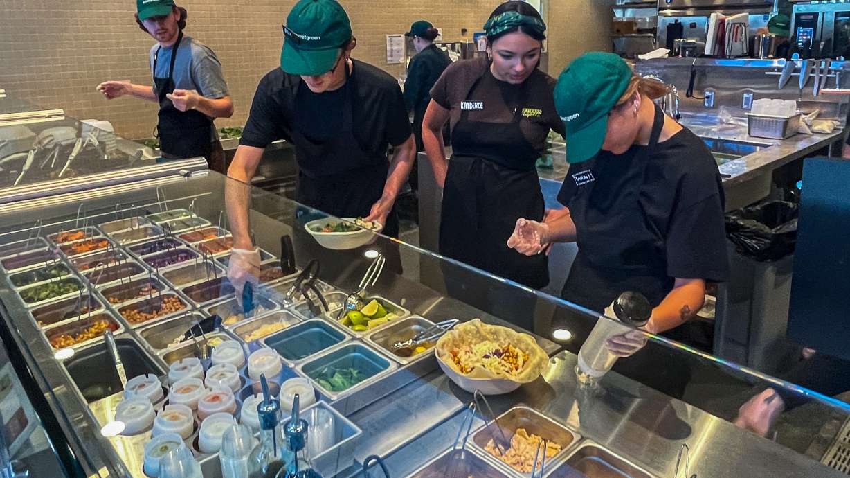 Sweetgreen employees prepare wraps and salad bowls during a preview event at the chain's new Salt Lake City location on Thursday. The chain's grand opening is slated for Tuesday.