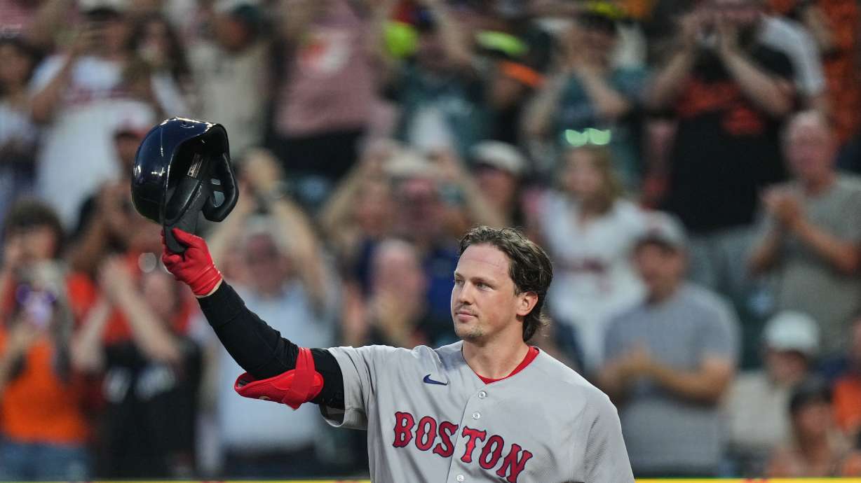 Boston Red Sox catcher Adley Rutschman acknowledges the crowd as he is honored during the first inning of a baseball game against the Baltimore Orioles, Thursday, Sept. 3, 2026, in Baltimore.