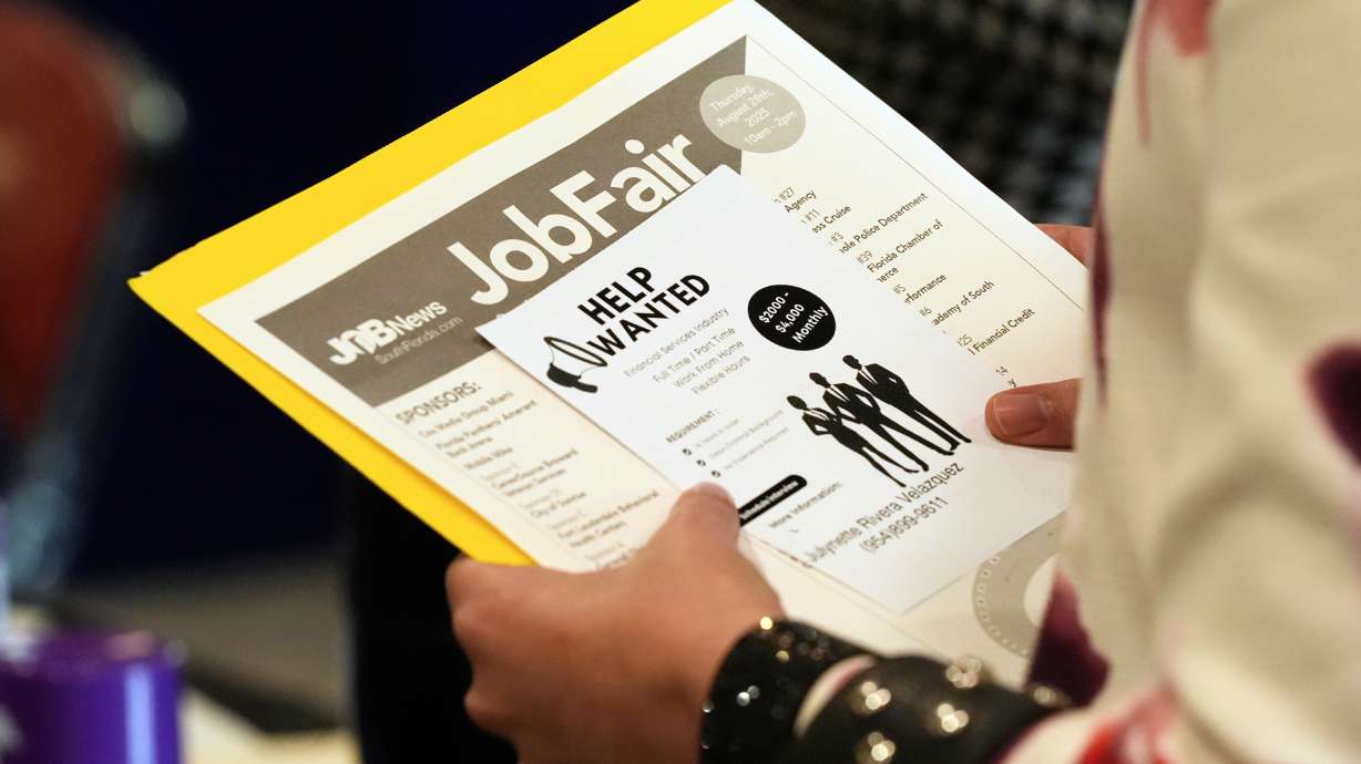 A job seeker waits to talk to a recruiter at a job fair Aug. 28, 2025, in Sunrise, Fla. The job market rebounded in August as employers added a surprising 162,000 jobs, and unemployment stayed at 4.1%, which could be good news for President Donald Trump.