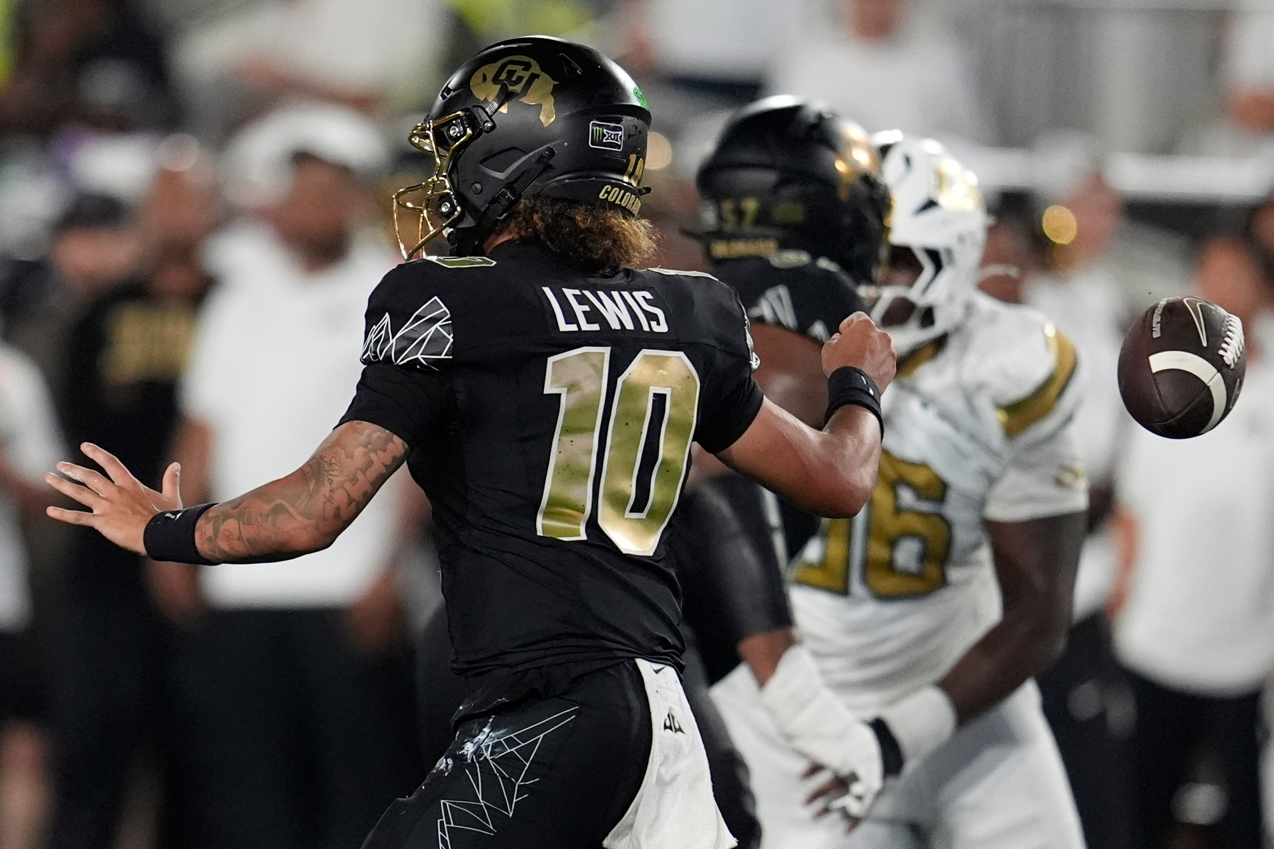Colorado quarterback Julian Lewis (10) loses the ball whilst passing against Georgia Tech during the first half of an NCAA college football game, Thursday, Sept. 3, 2026, in Atlanta. 