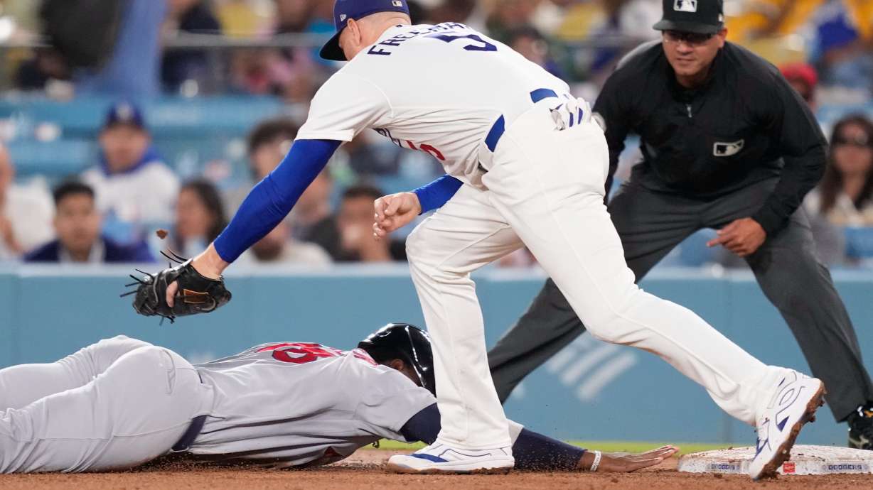 St. Louis Cardinals' Jordan Walker, left, is tagged out at first by Los Angeles Dodgers first baseman Freddie Freeman after being caught off base during the fifth inning of a baseball game Thursday, Sept. 3, 2026, in Los Angeles.