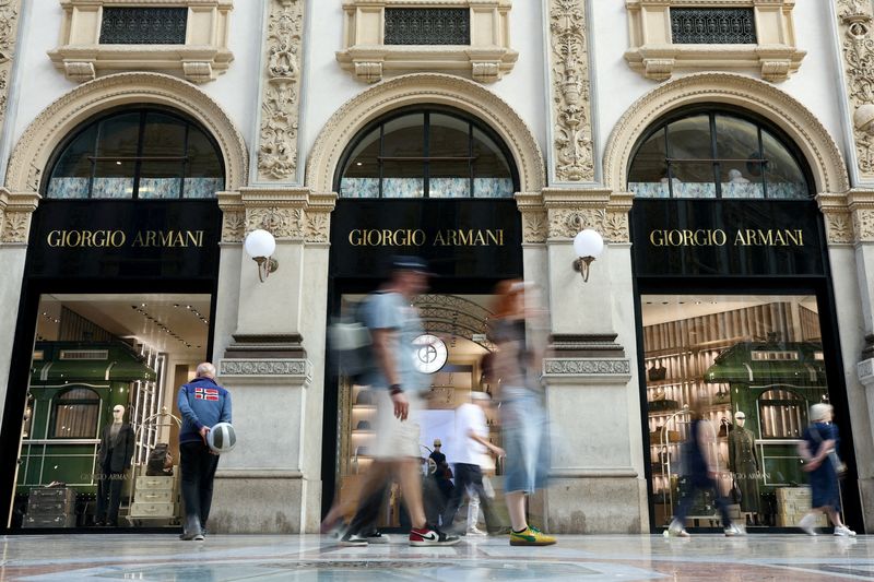 People walk past a Giorgio Armani store in Galleria Vittorio Emanuele II, in Milan, Friday. One year after the death of Armani, the Italian fashion house is entering a pivotal period as the clock starts ticking on plans for an initial ​stake sale.