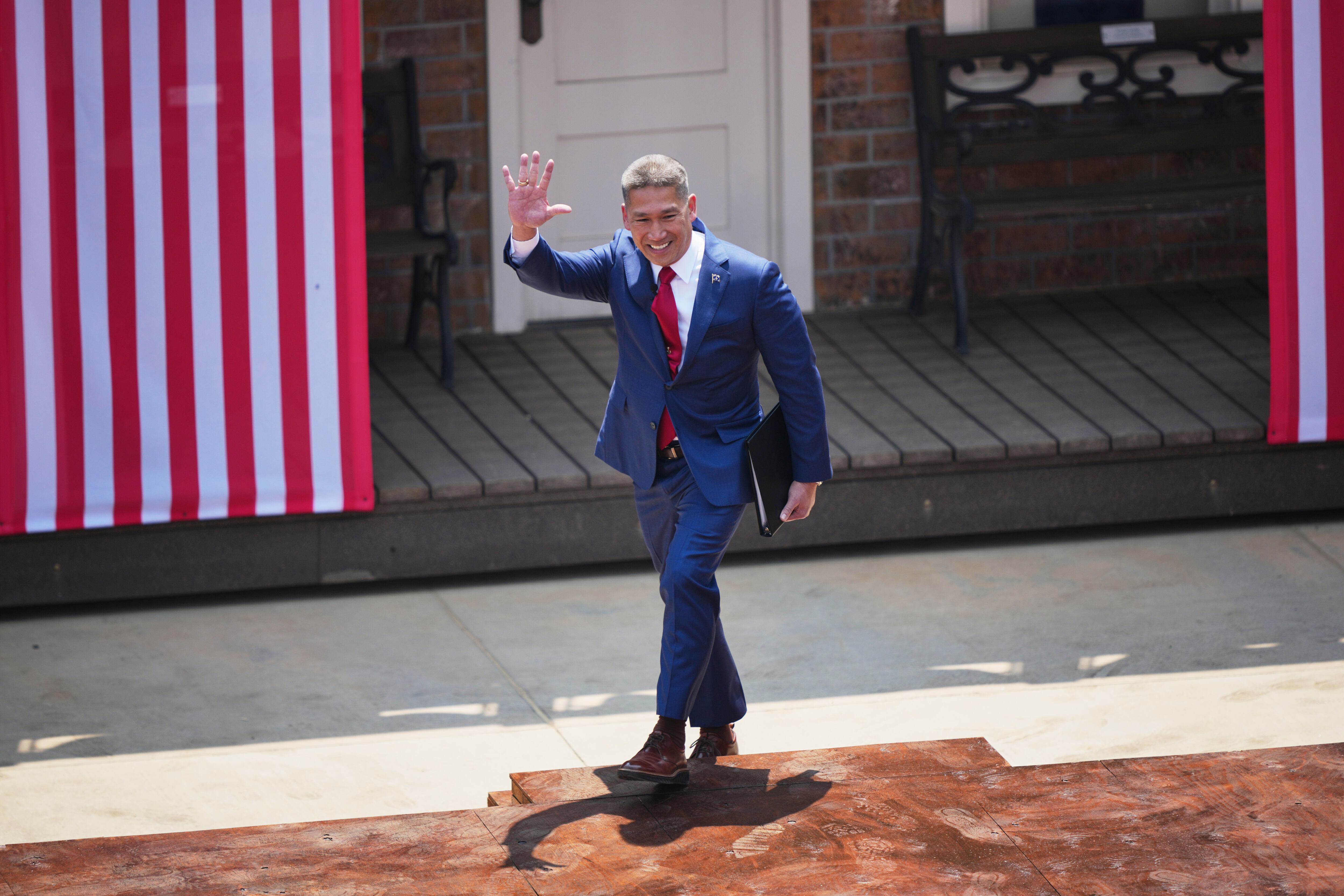 Acting Secretary of the Navy is Hung Cao walks on stage at the Burning Hills Amphitheater during the Theodore Roosevelt Presidential Library opening ceremony July 1, in Medora, N.D.