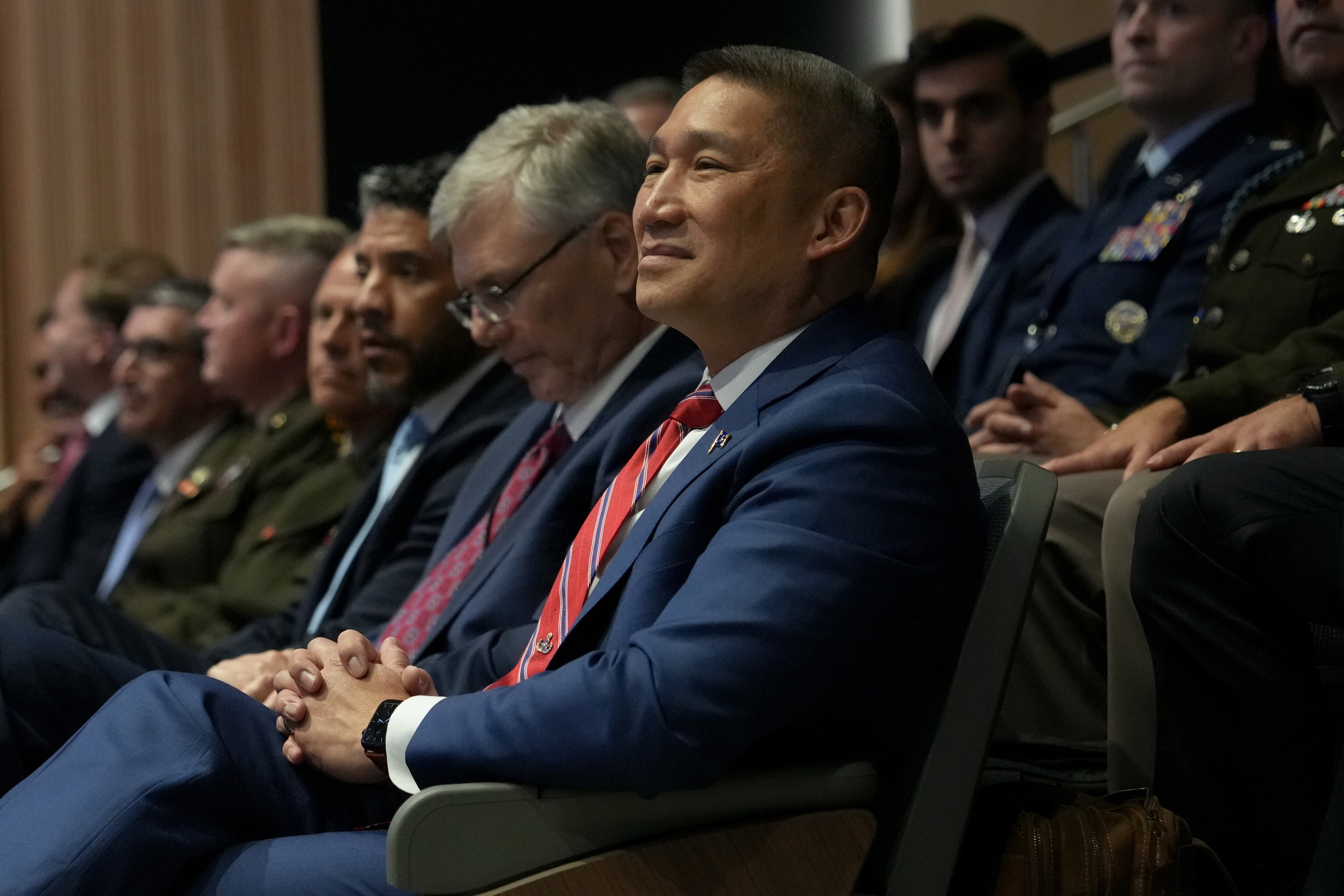 Acting Secretary of the Navy Hung Cao listens as President Donald Trump speaks during a roundtable at the Pennsylvania Defense and Innovation Summit, July 15, at the United States Army War College in Carlisle, Pa.