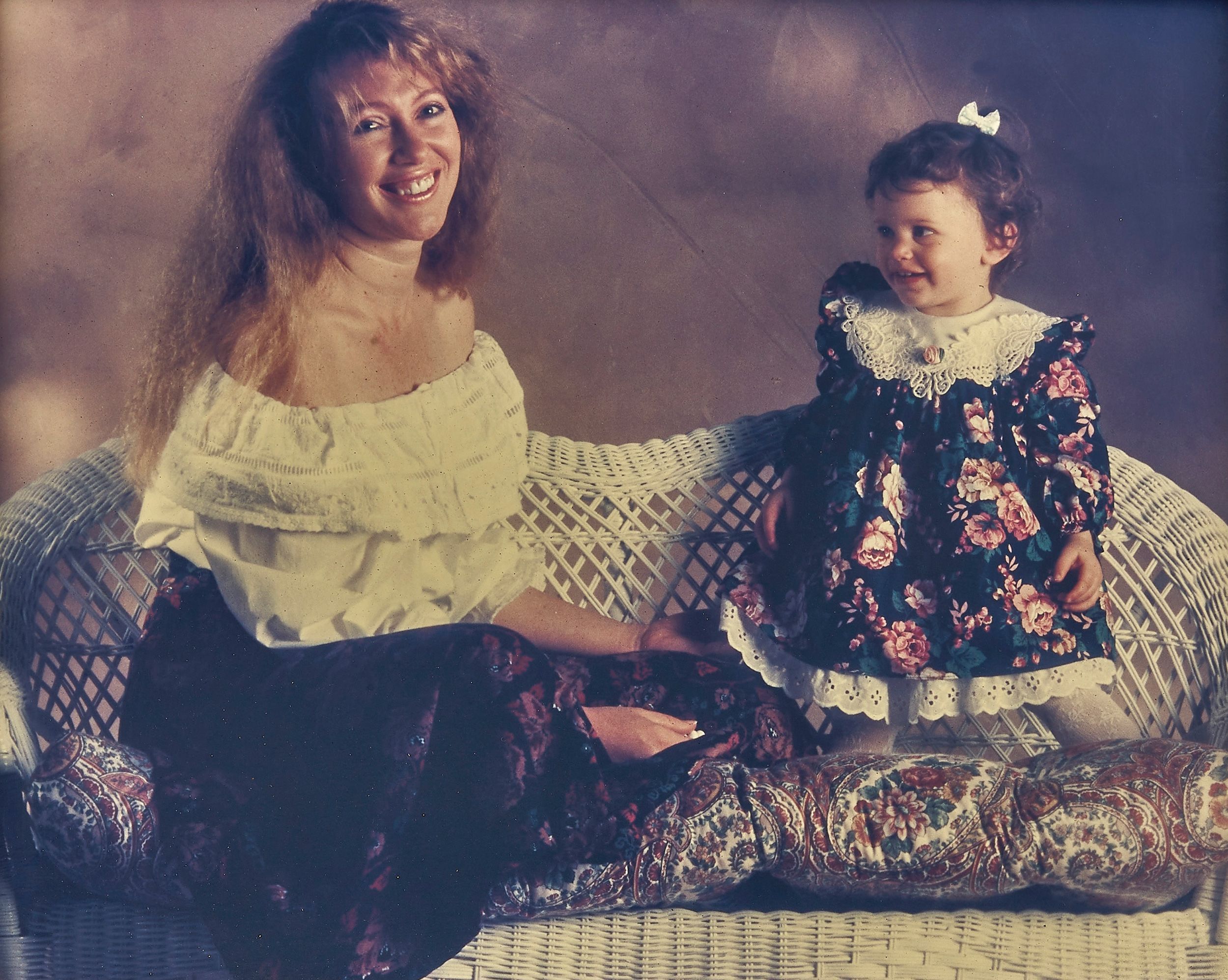 Chuck is a photographer and he took this photo of Diane with one of their daughters in 1991.