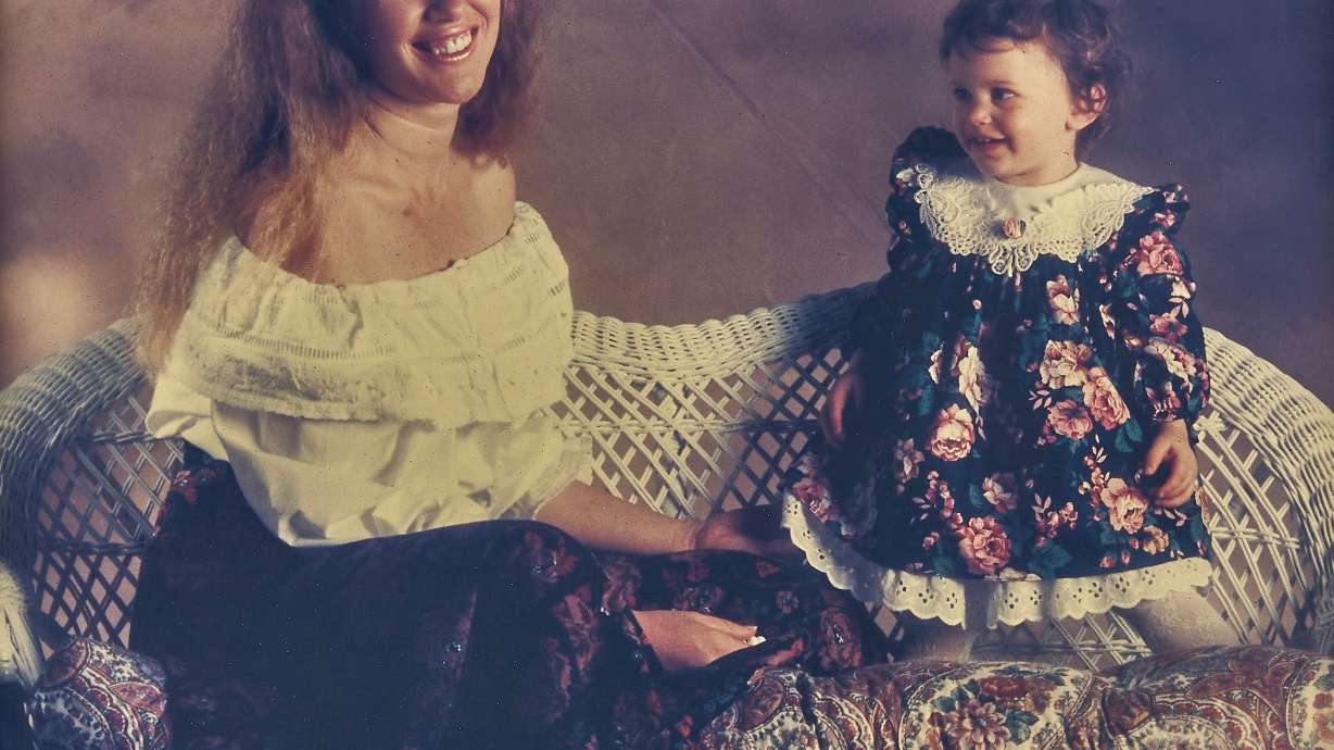 Chuck is a photographer and he took this photo of Diane with one of their daughters in 1991.