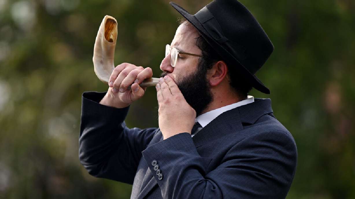Rabbi Moshe Nigri blows the shofar, the ram's horn, signifying the arrival of God on Rosh Hashanah at the University of Utah in Salt Lake City on Sept. 3, 2025.