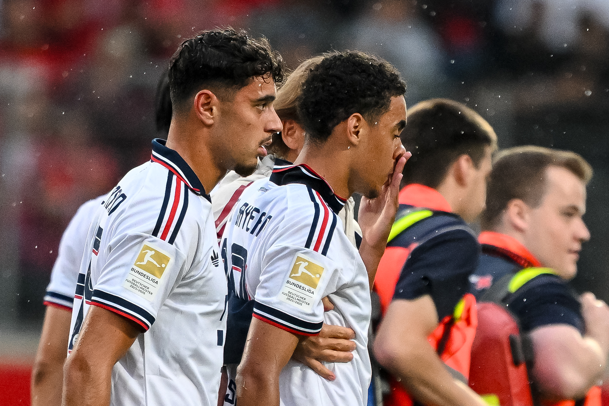 Bayern's Jamal Musiala, second left, leaves the field during a friendly soccer match between FC Heidenheim and FC Bayern Munich in Heidenheim, Germany, Tuesday, Aug. 18, 2026. 