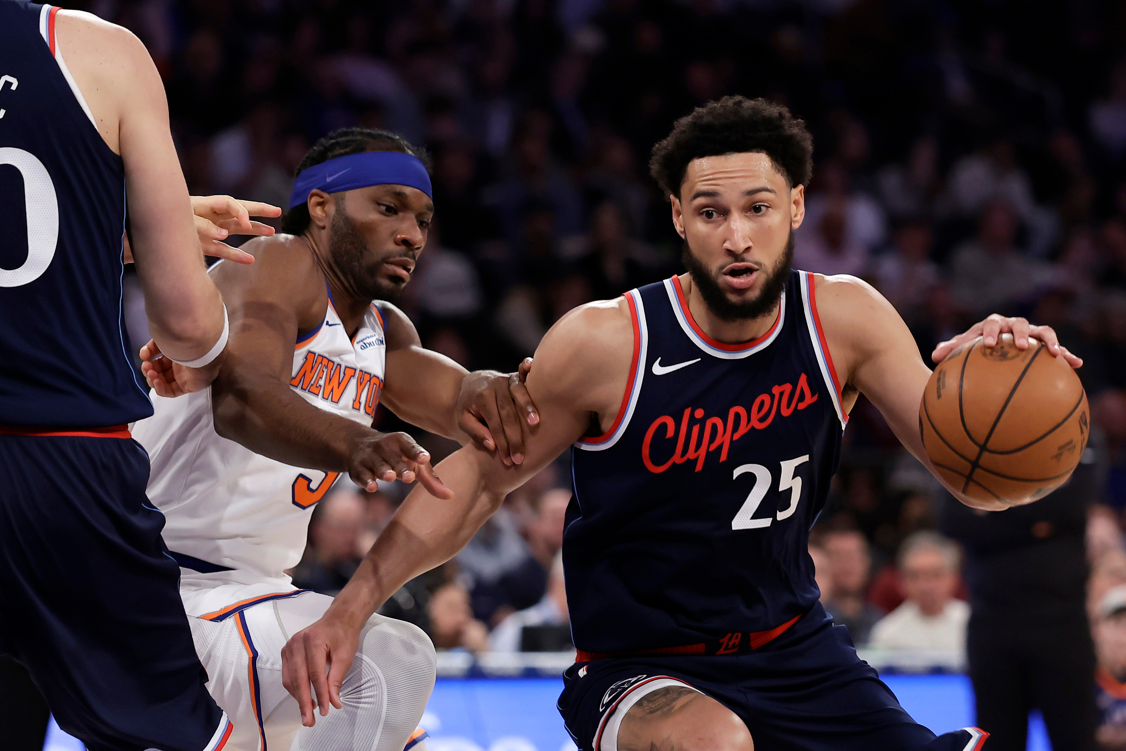 FILE - LA Clippers guard Ben Simmons drives past New York Knicks forward Precious Achiuwa during the first half of an NBA basketball game in New York, March 26, 2025. 