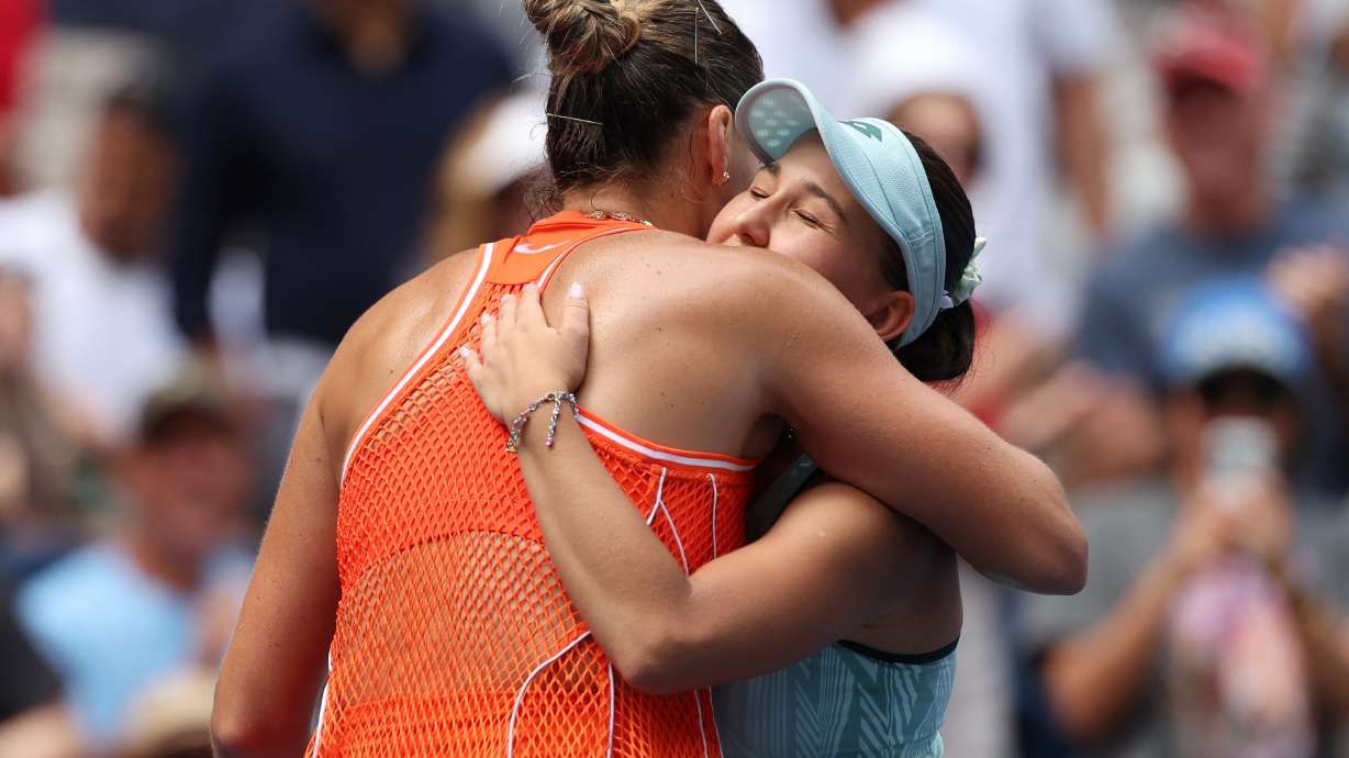 Aryna Sabalenka, of Belarus, left, embraces Kamilla Rakhimova, of Uzbekistan, after Sabalenka won their match during the third round of the U.S. Open tennis championships Friday, Sept. 4, 2026, in New York.