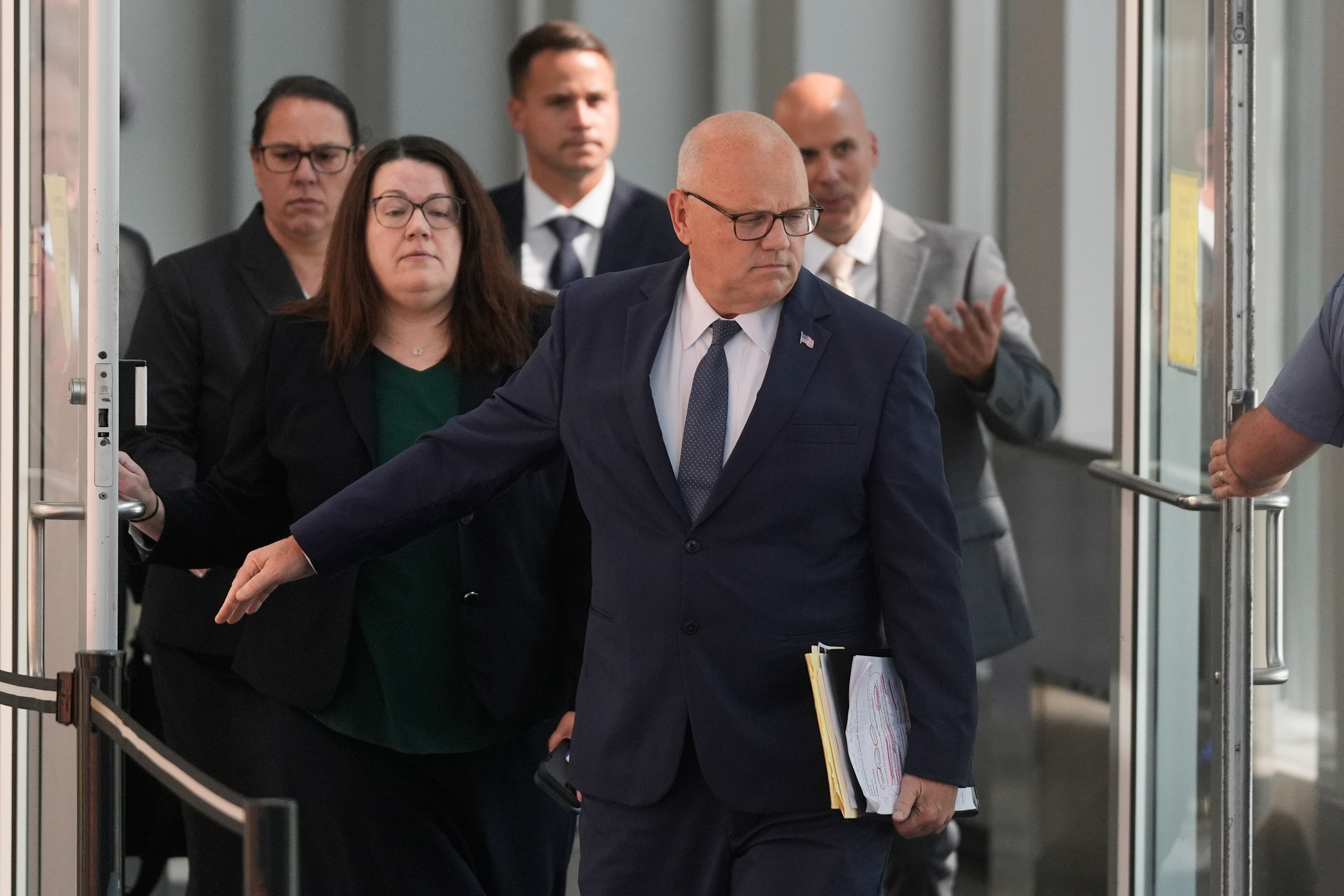 District Attorney for Plymouth County Timothy Cruz leaves court after the judge declared a mistrial in Lindsay Clancy's murder trial at Plymouth County Superior Court, Friday, in Plymouth, Mass. Cruz did not say whether there would be a second trial of Clancy.