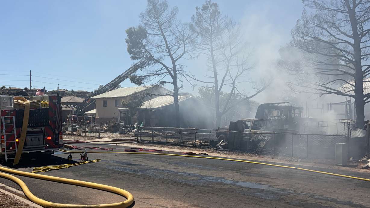 Smoke rises from a house fire in St. George on Friday.