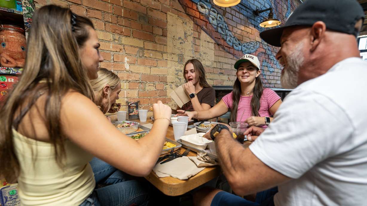 Mia Trionfo, Emily Morrison, Cora Trionfo, Lina Trionfo and Mike Trionfo enjoy their food at ROCTACO in Salt Lake City on Friday. Five years after opening, Salt Lake City restaurant ROCTACO is looking to expand — if the fit is right.