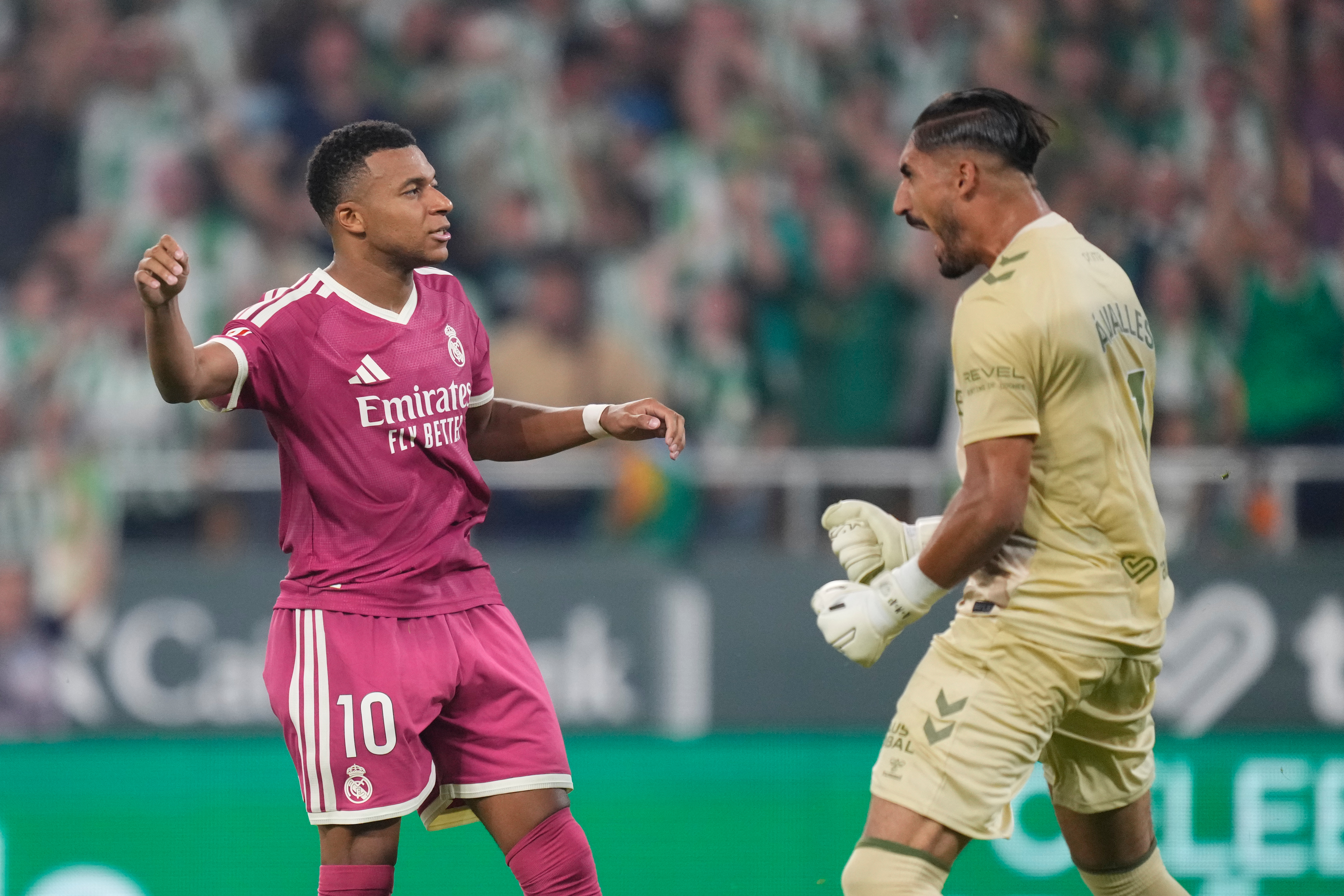 Real Madrid's Kylian Mbappe, left, reacts after missing a penalty kick in front of Betis' goalkeeper Alvaro Valles during the Spanish La Liga soccer match between Real Betis and Real Madrid in Seville, Spain, Friday, Sept. 4, 2026. 