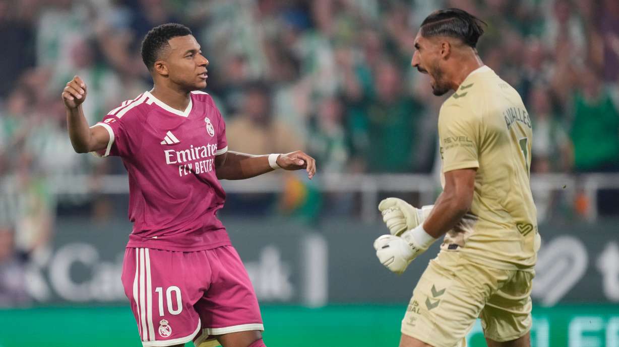 Real Madrid's Kylian Mbappe, left, reacts after missing a penalty kick in front of Betis' goalkeeper Alvaro Valles during the Spanish La Liga soccer match between Real Betis and Real Madrid in Seville, Spain, Friday, Sept. 4, 2026.