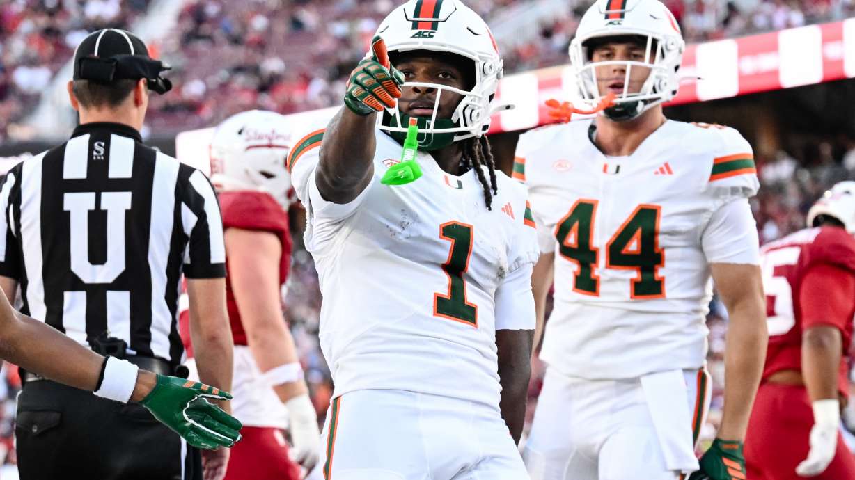 Miami wide receiver Malachi Toney (1) reacts after scoring a touchdown against Stanford during the first half of an NCAA college football game Friday, Sept. 4, 2026, in Stanford, Calif.