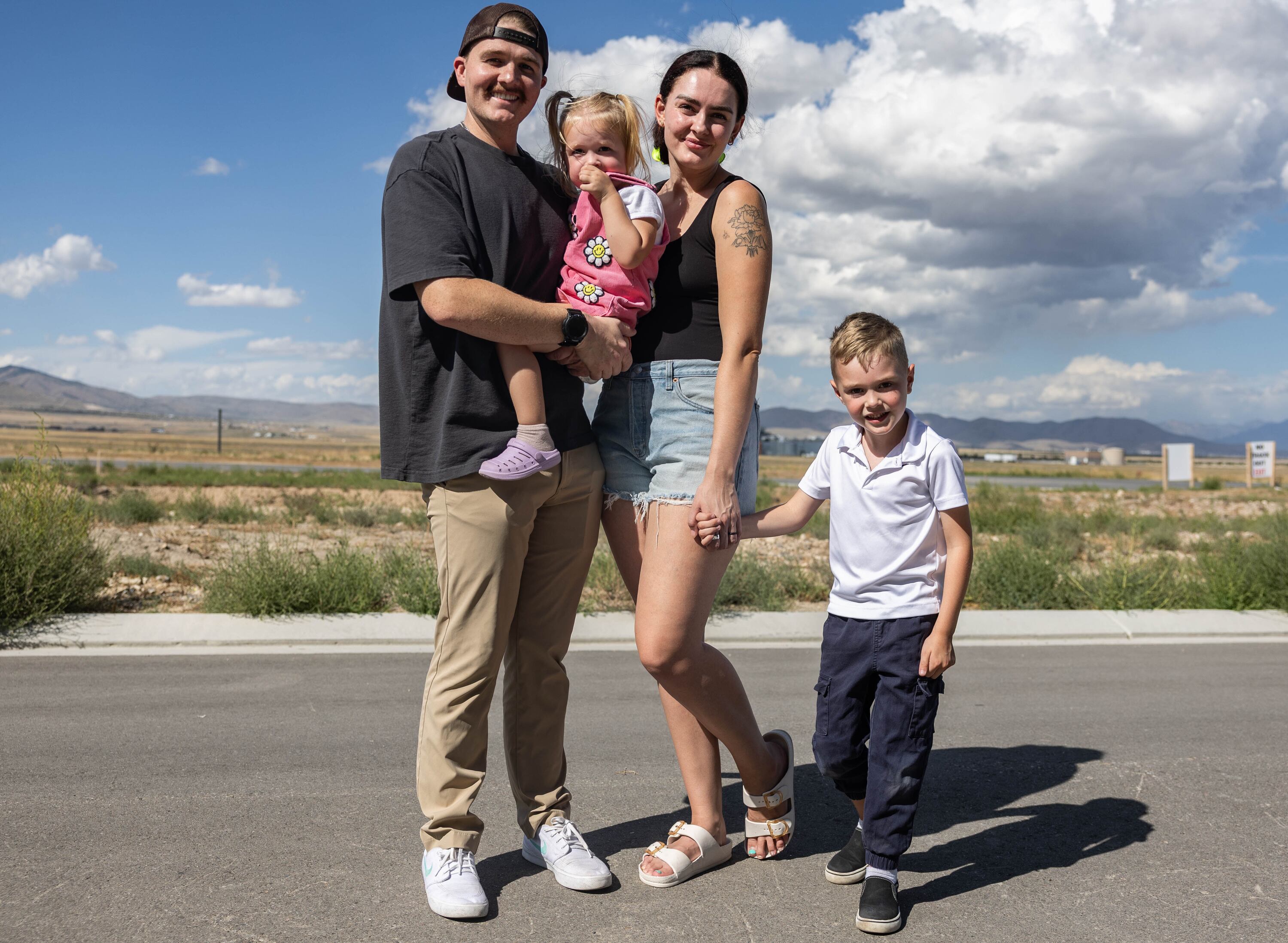 Austin and Jessi Campbell pose for a photo with their two children, Piper and Quinn, near their home in Eagle Mountain on Tuesday. Austin Campbell has a positive outlook despite losing his job.
