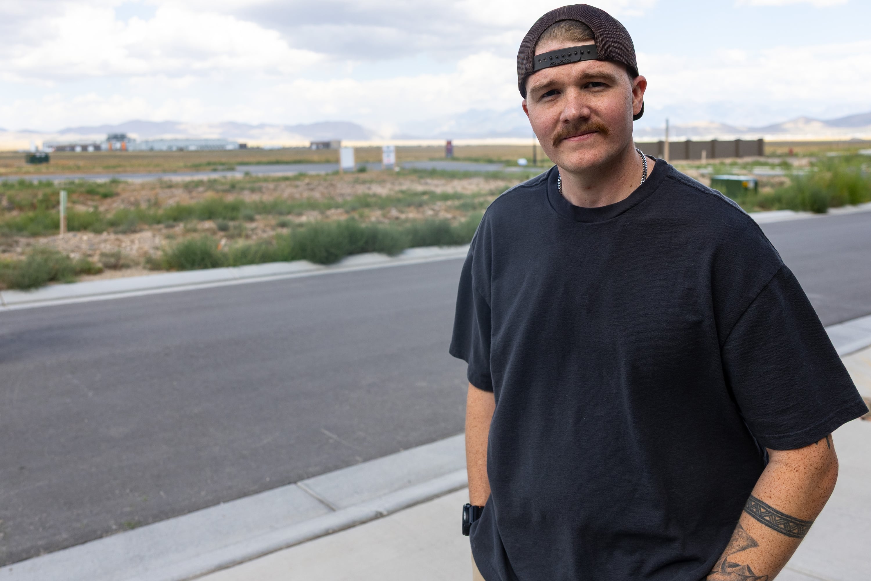 Austin Campbell poses for a photo near his home in Eagle Mountain on Tuesday. He is among the over 700 workers laid off after the Tyson Food plant announced its closure, leaving him 60 days to find work elsewhere.