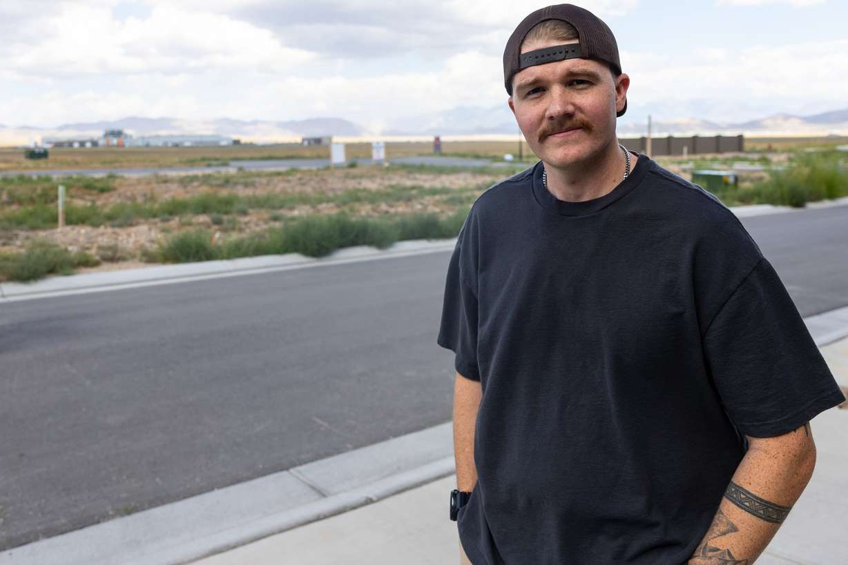 Austin Campbell poses for a photo near his home in Eagle Mountain on Tuesday. He is among the over 700 workers laid off after the Tyson Food plant announced its closure, leaving him 60 days to find work elsewhere.