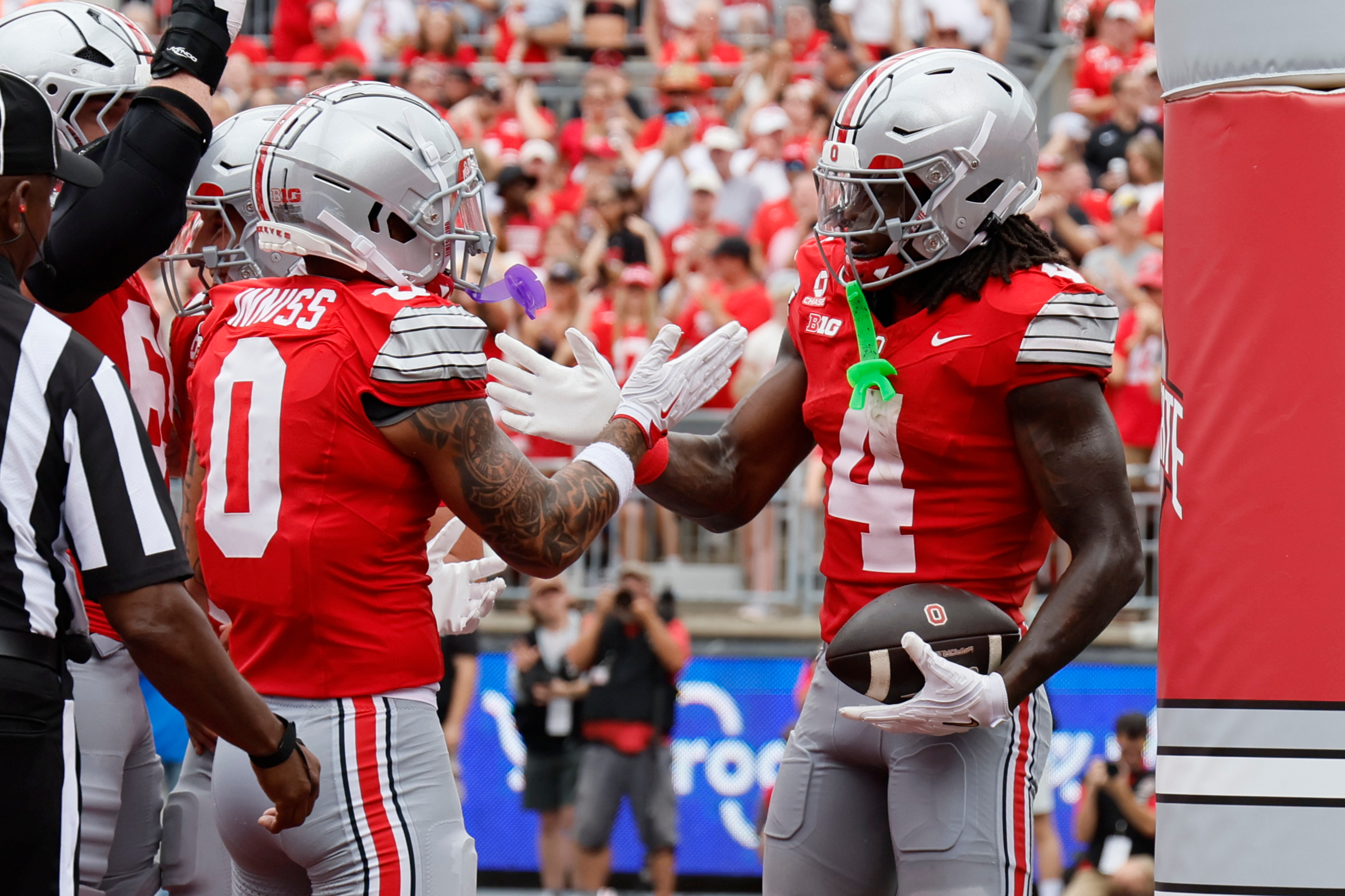 Ohio State wide receiver Jeremiah Smith, right, celebrates his touchdown reception against Ball State with teammate Brandon Inniss during the first half of an NCAA college football game, Saturday, Sept. 5, 2026, in Columbus, Ohio. 