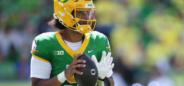 Moore throws for 3 TDs and No. 2 Oregon overcomes a slow start to beat Boise State 34-27