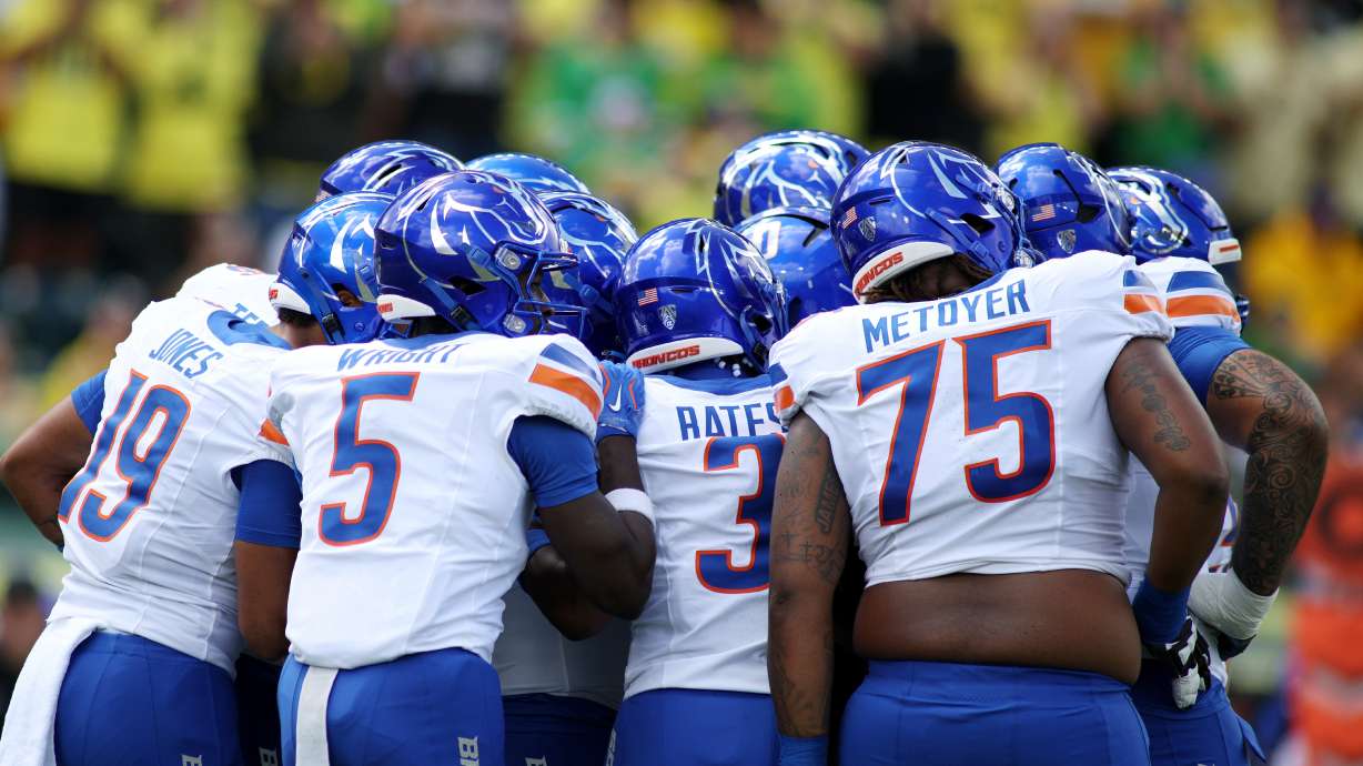 Boise State players group up during the first half of an NCAA college football game against Oregon, Saturday, Sept. 5, 2026, in Eugene, Ore.