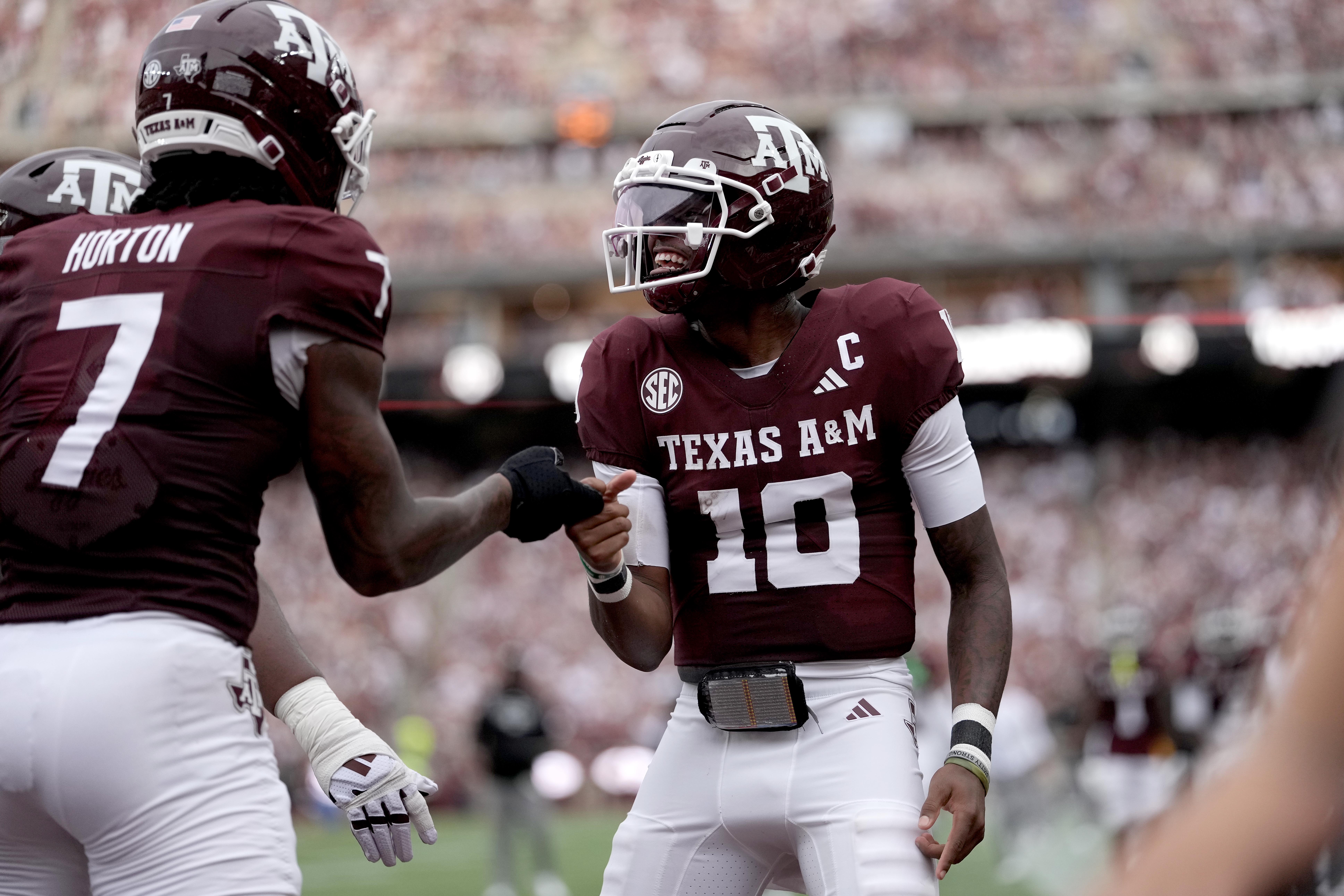 Texas A&M quarterback Marcel Reed (10) reacts with teammate Isaiah Horton (7) after a touchdown against Missouri State during the first quarter of an NCAA college football game Saturday, Sept. 5, 2026, in College Station, Texas. 