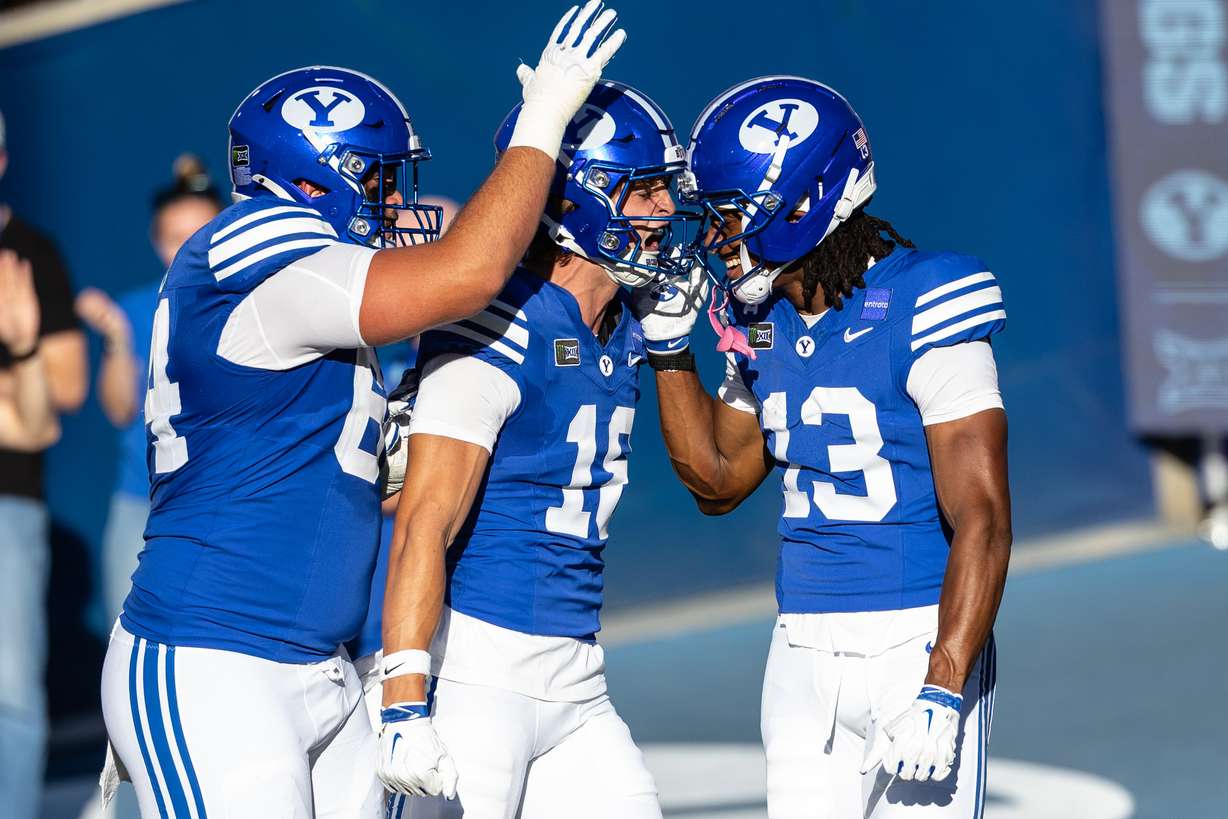 BYU Cougars wide receiver Jojo Phillips (13) celebrates with teammates after scoring a touchdown during a game against Utah Tech at LaVell Edwards Stadium in Provo on Saturday, Sept. 5, 2026.